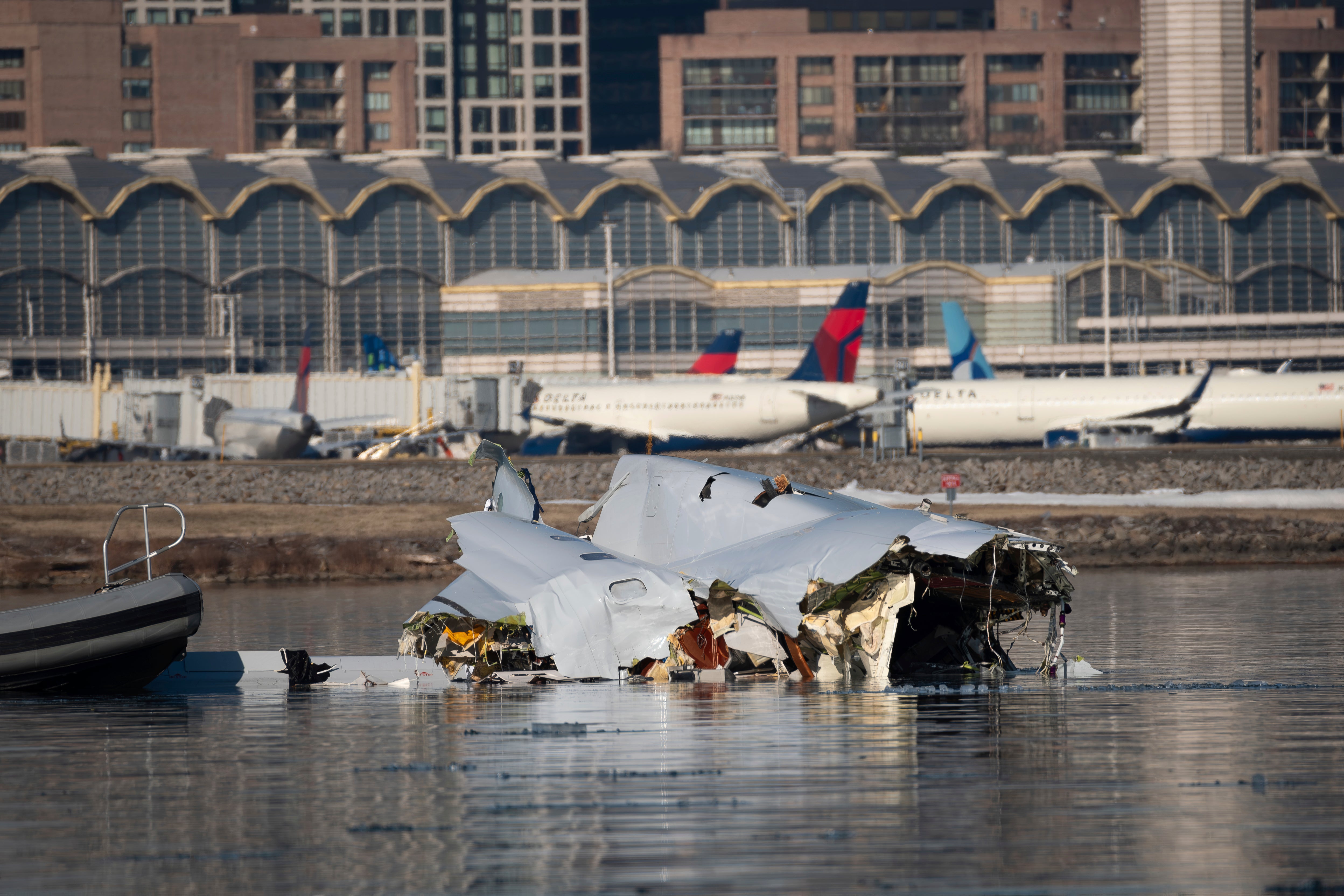 Wreckage is seen in the Potomac River near Ronald Reagan Washington National Airport, Thursday