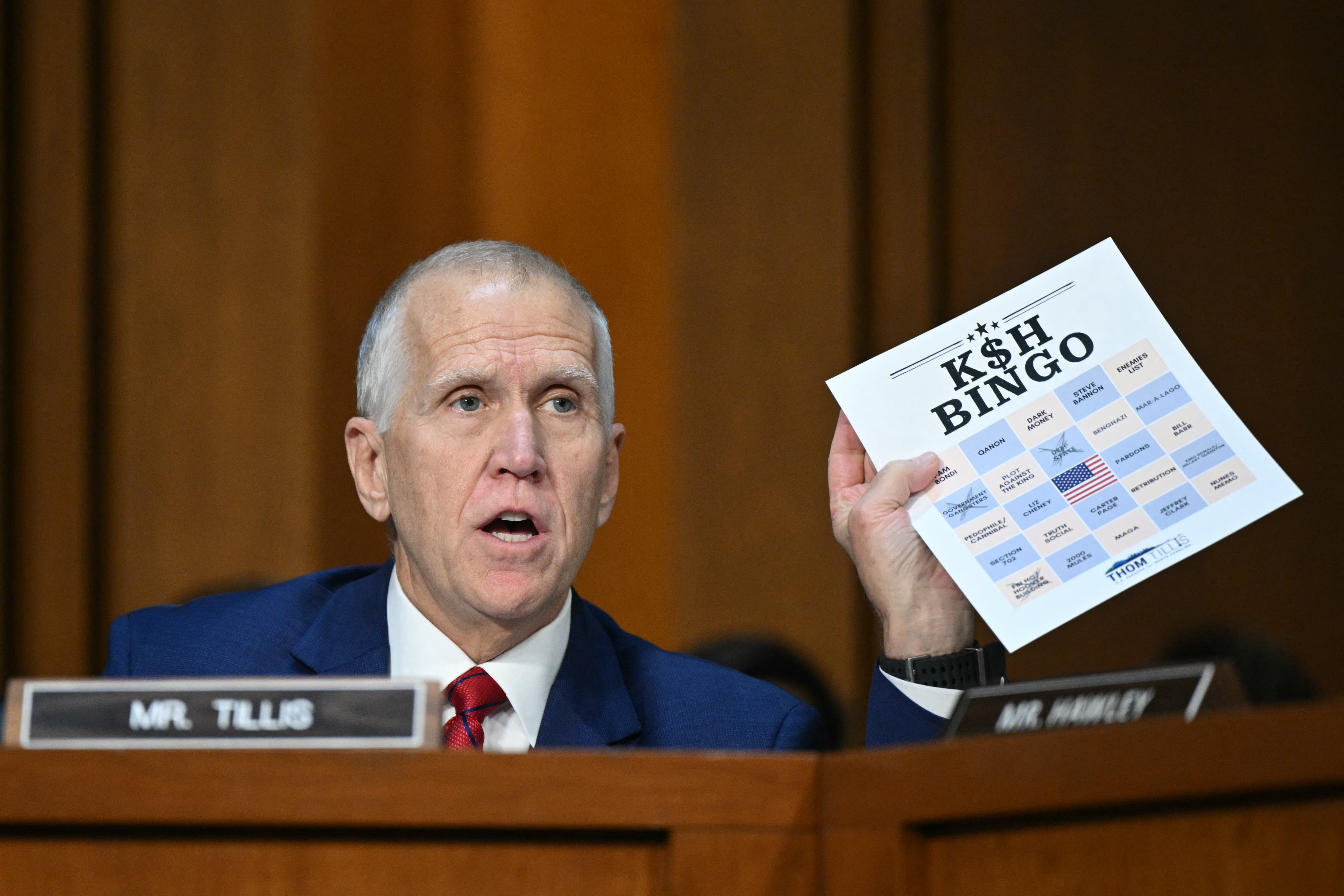 Senator Thom Tillis, Republican from North Carolina, holds up a 