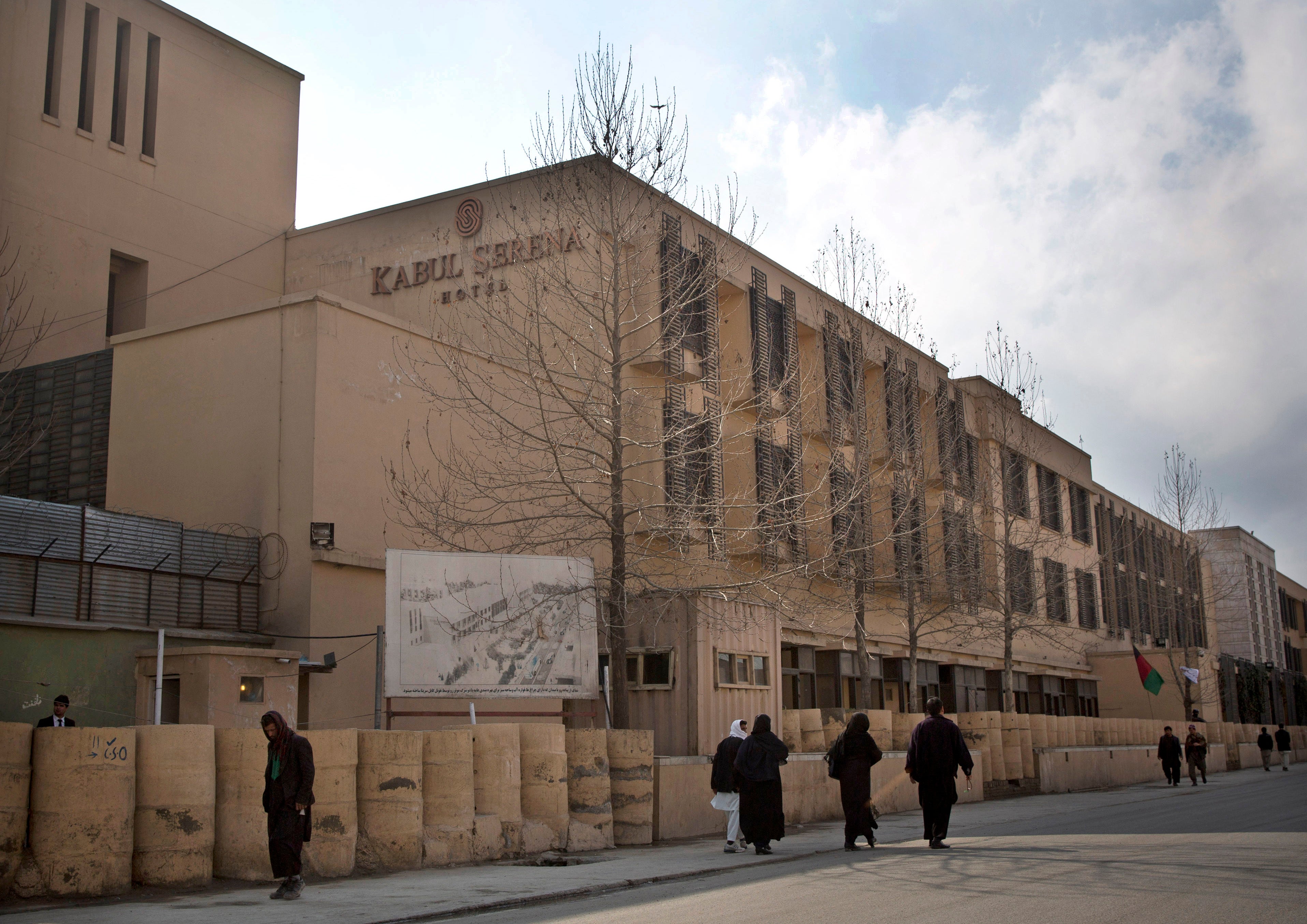 FIAfghans walk by the Serena hotel in downtown Kabul, Afghanistan, March 21, 2014. (AP Photo/Anja Niedringhaus, File)