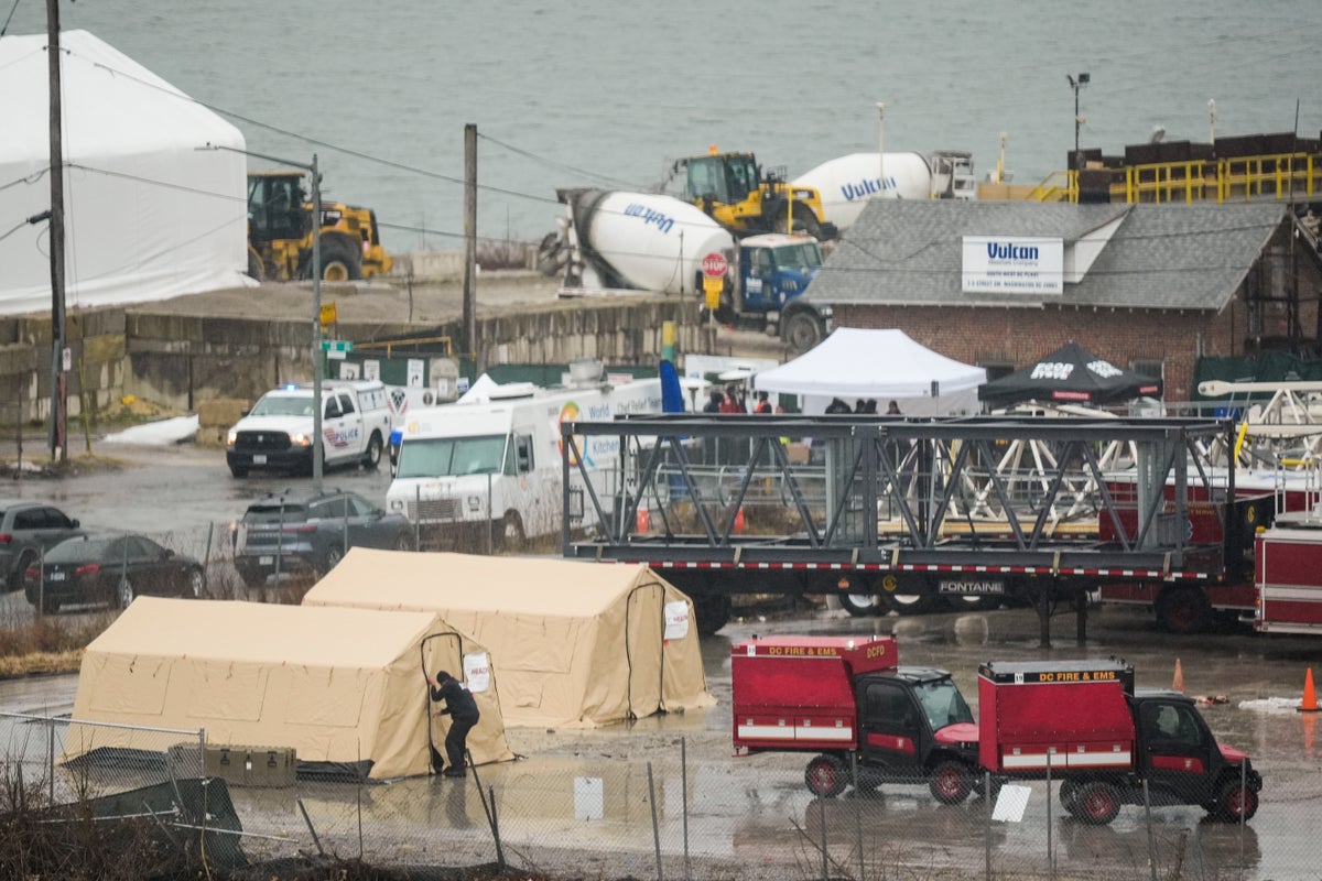 Watch live: View of DC plane crash site as officials continue search for 12 victims