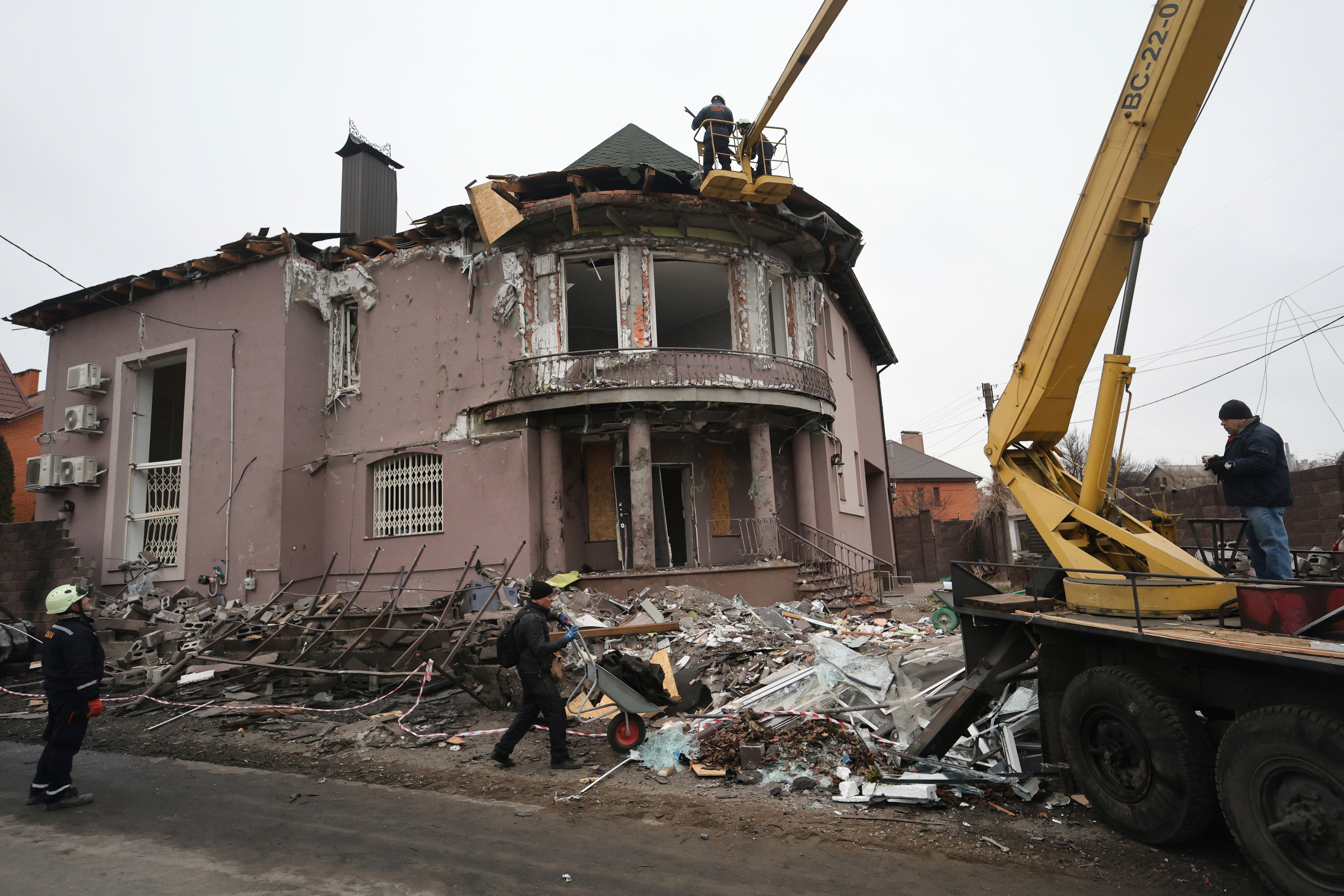 Rescue workers at the site of Russian strike on a residential neighbourhood in Zaporizhzhia