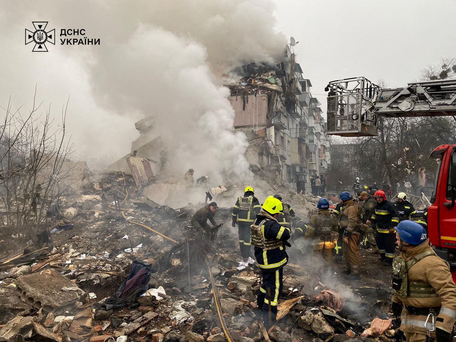 Rescuers work at the site of an apartment building hit by a Russian missile strike