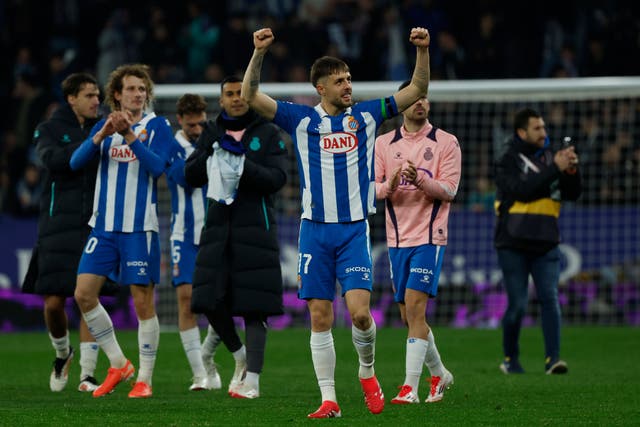 Espanyol players celebrate after victory against Real Madrid (Joan Monfort/AP)