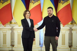 Ukraine's president Volodymyr Zelensky shaking hands with Moldova's president Maia Sandu ahead of their meeting