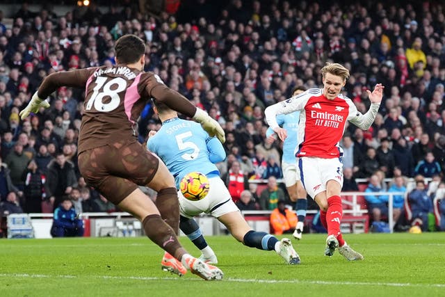 Arsenal’s Martin Odegaard (right) scores his side’s first goal of the game in the 5-1 win over Manchester City (Adam Davy/PA)