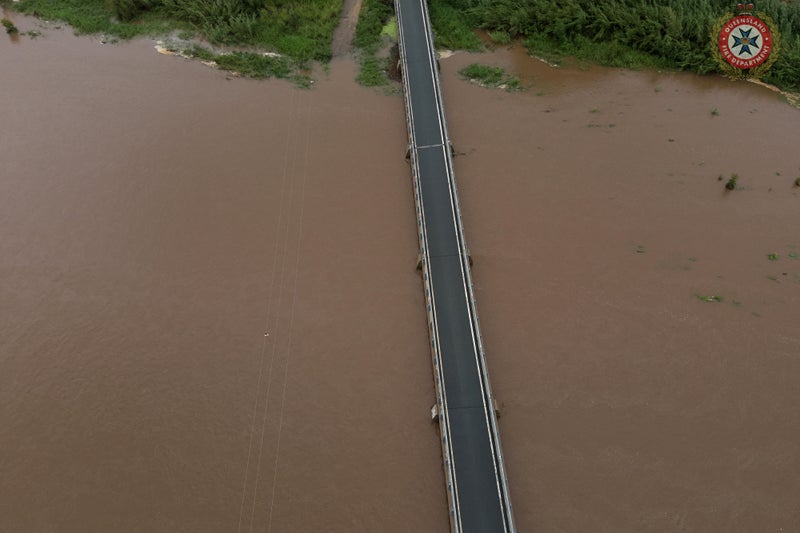 One dead and major bridge collapses after Australia’s flood worsens 