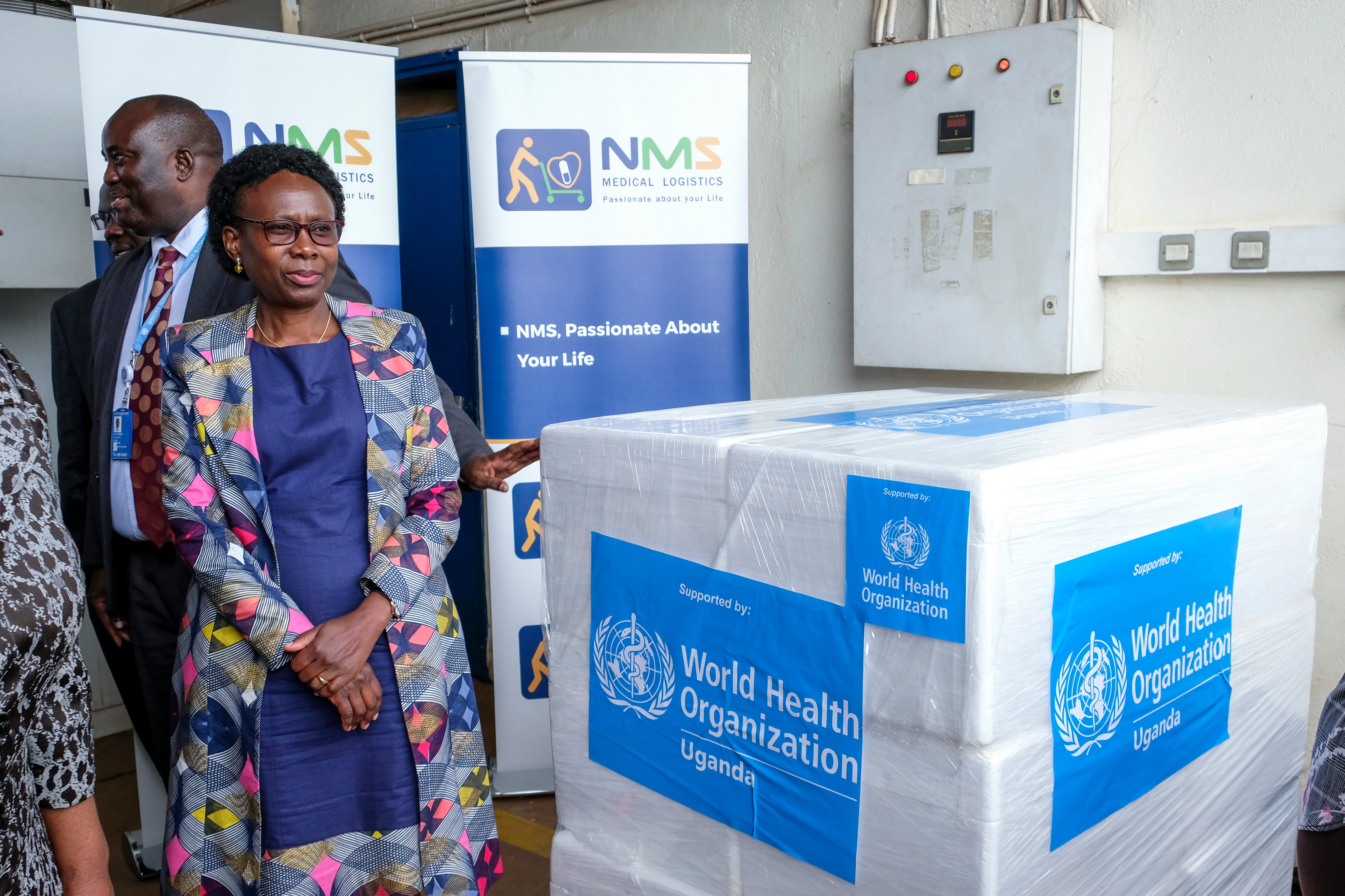 Uganda's Minister of Health Jane Ruth Aceng receives boxes containing one of three candidate vaccines against the Sudan strain of the Ebola virus, in Entebbe, Uganda, on Dec. 8, 2022