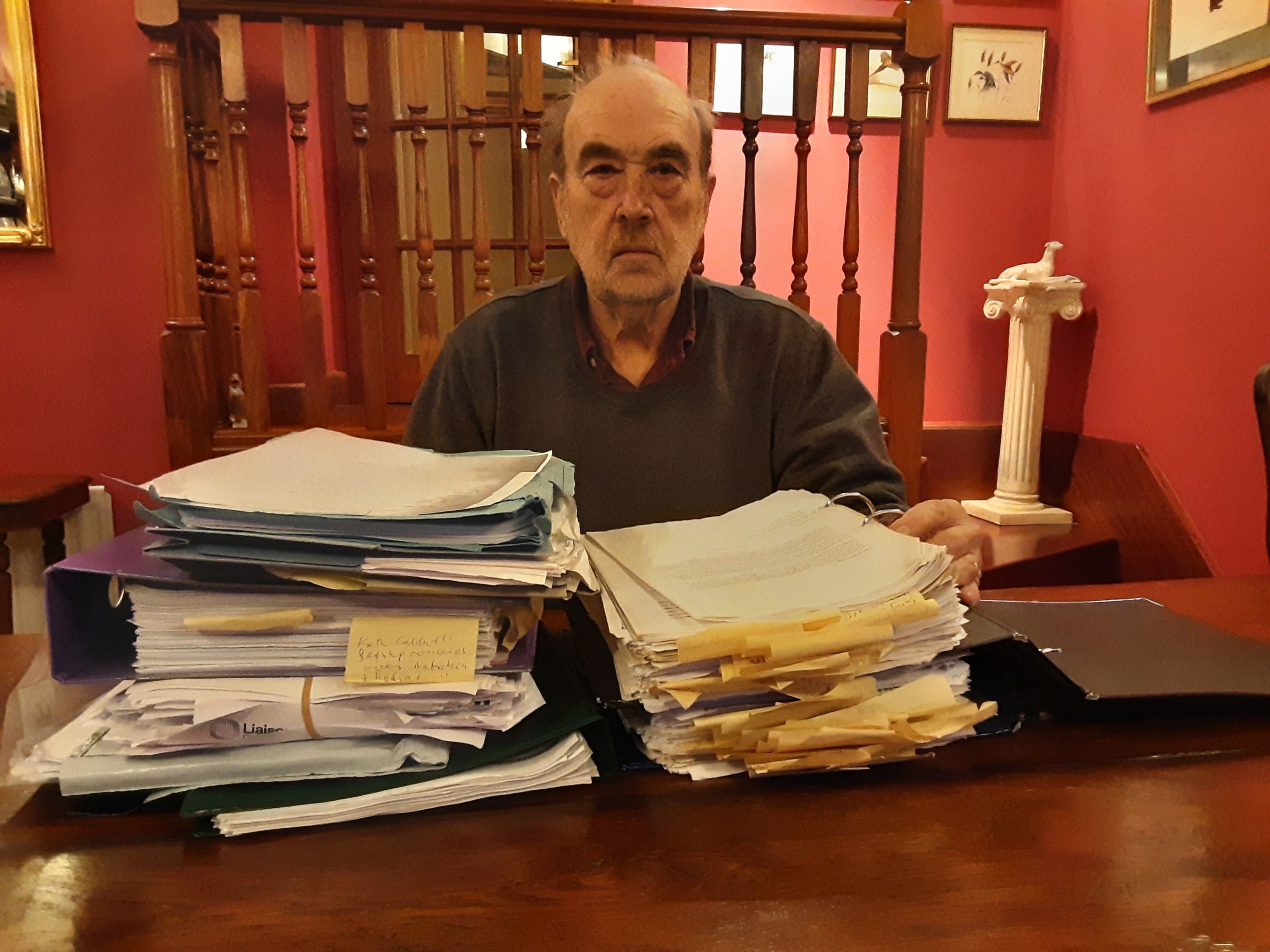 Steve Panton with the mounds of paperwork the family has used to fight for justice