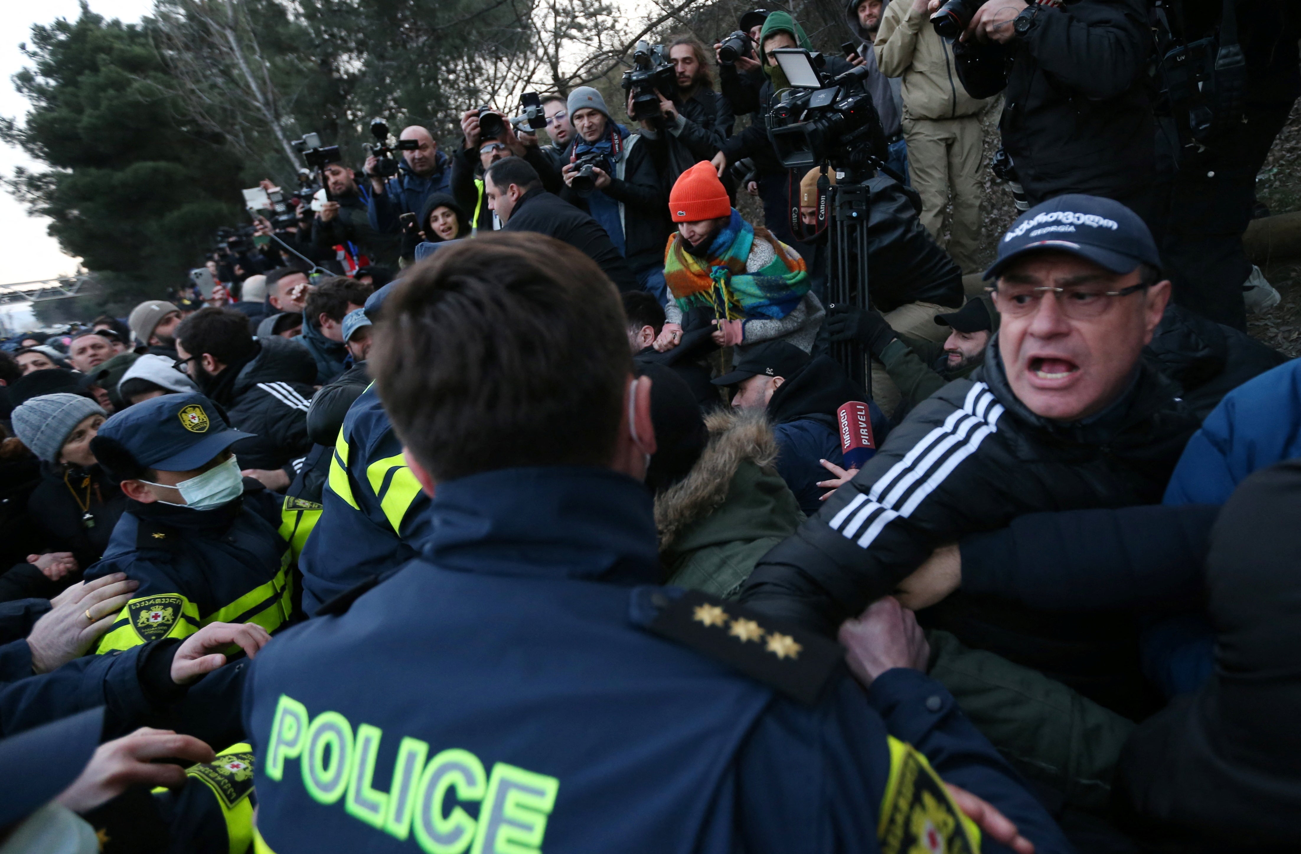 Protesters scuffle with police during an anti-government rally demanding new parliamentary elections in Tbilisi, Georgia February 2