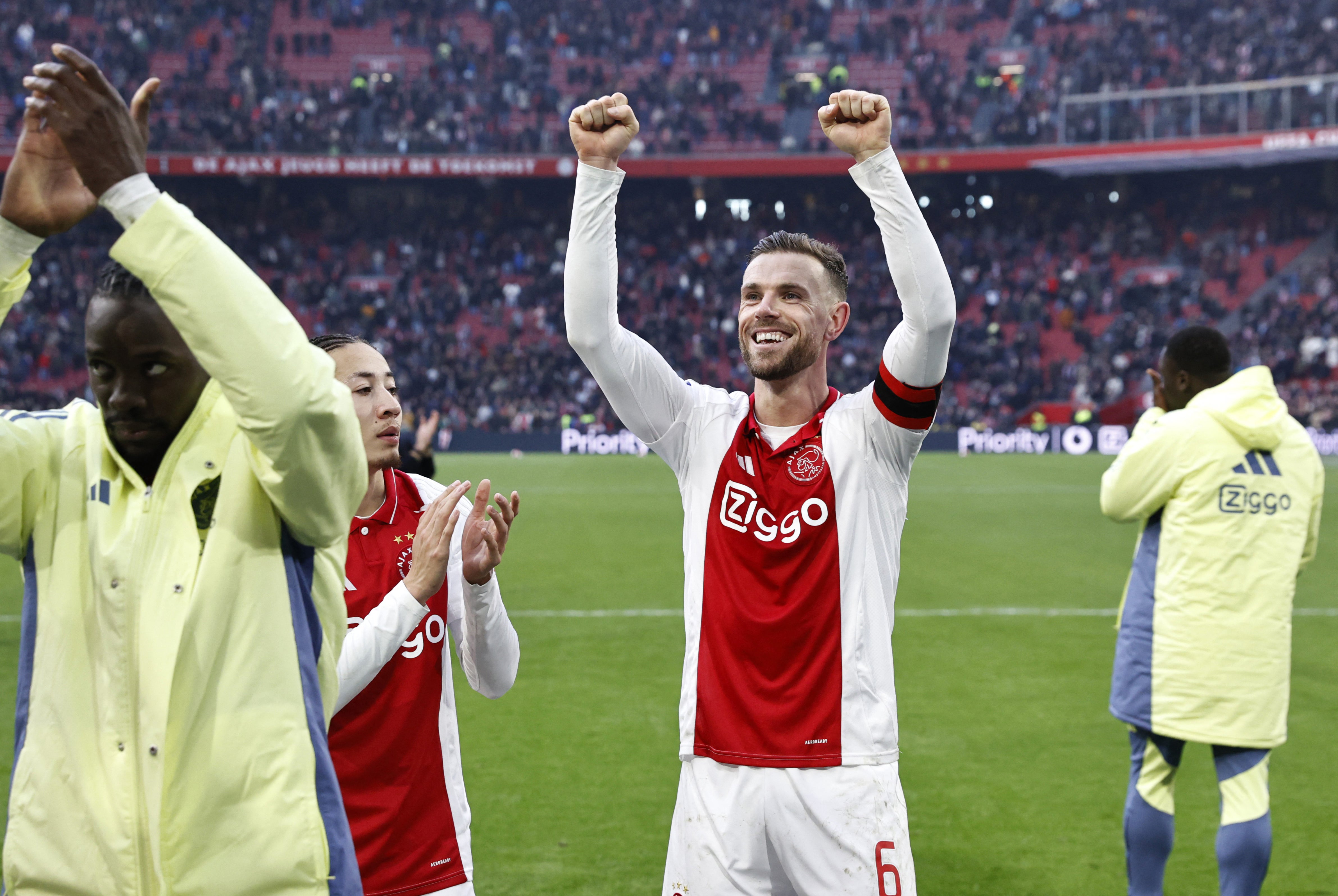 Henderson celebrates Ajax's 2-1 win over Feyenoord on Sunday