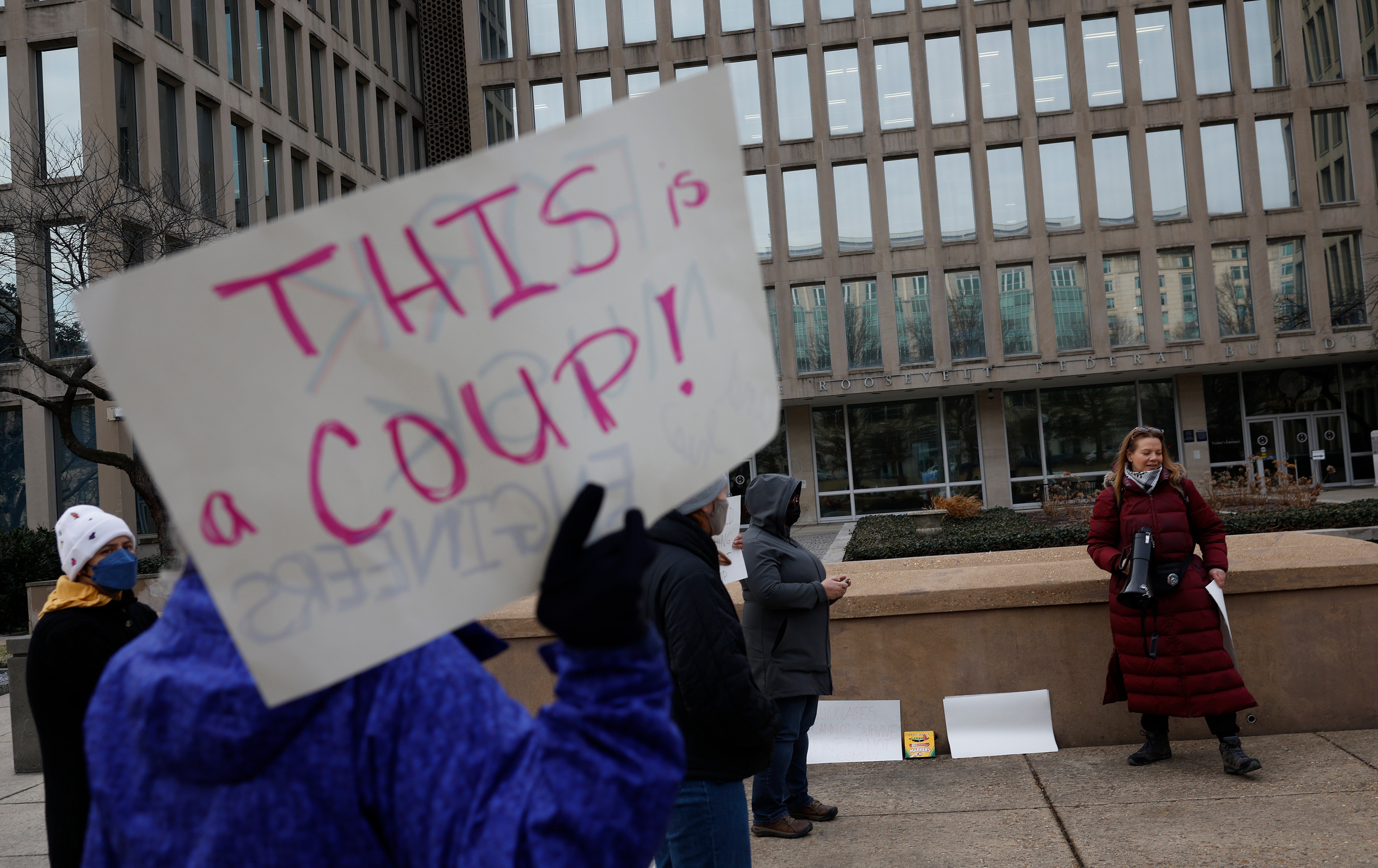 Protesters gather outside of the Theodore Roosevelt Federal Building headquarters of the U.S. Office of Personnel Management on February 03, 2025 in Washington, DC