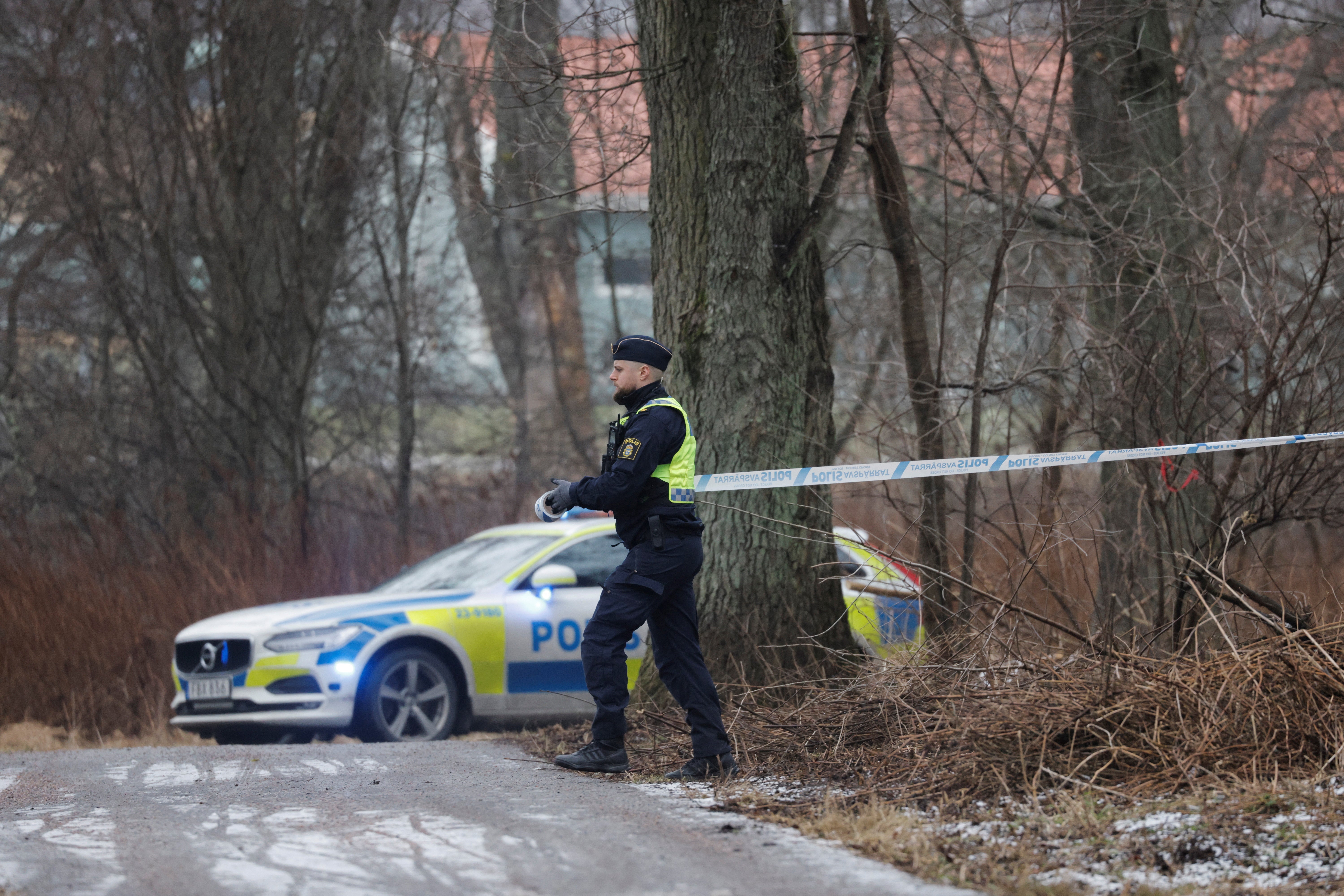 Police seal off the scene of the shooting