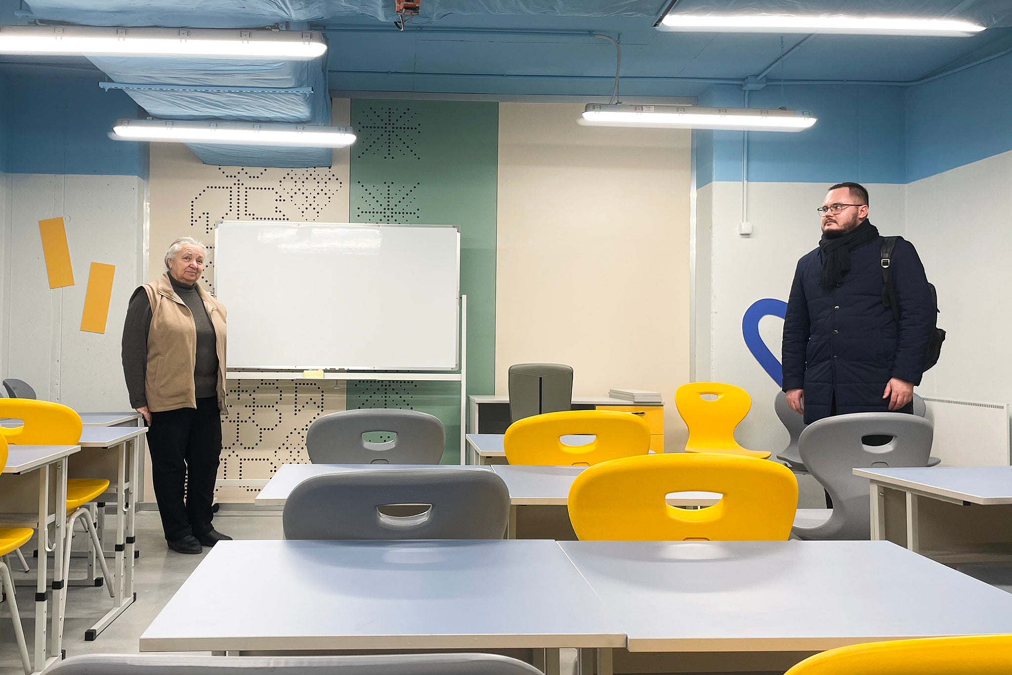 Head teacher Valentyna Yerashova, left, with MP Oleksandr Vasiuk at the new underground school in Zaporizhzhia