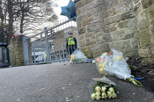 Floral tributes were left outside All Saints Catholic High School in Sheffield (Sophie Robinson/PA)