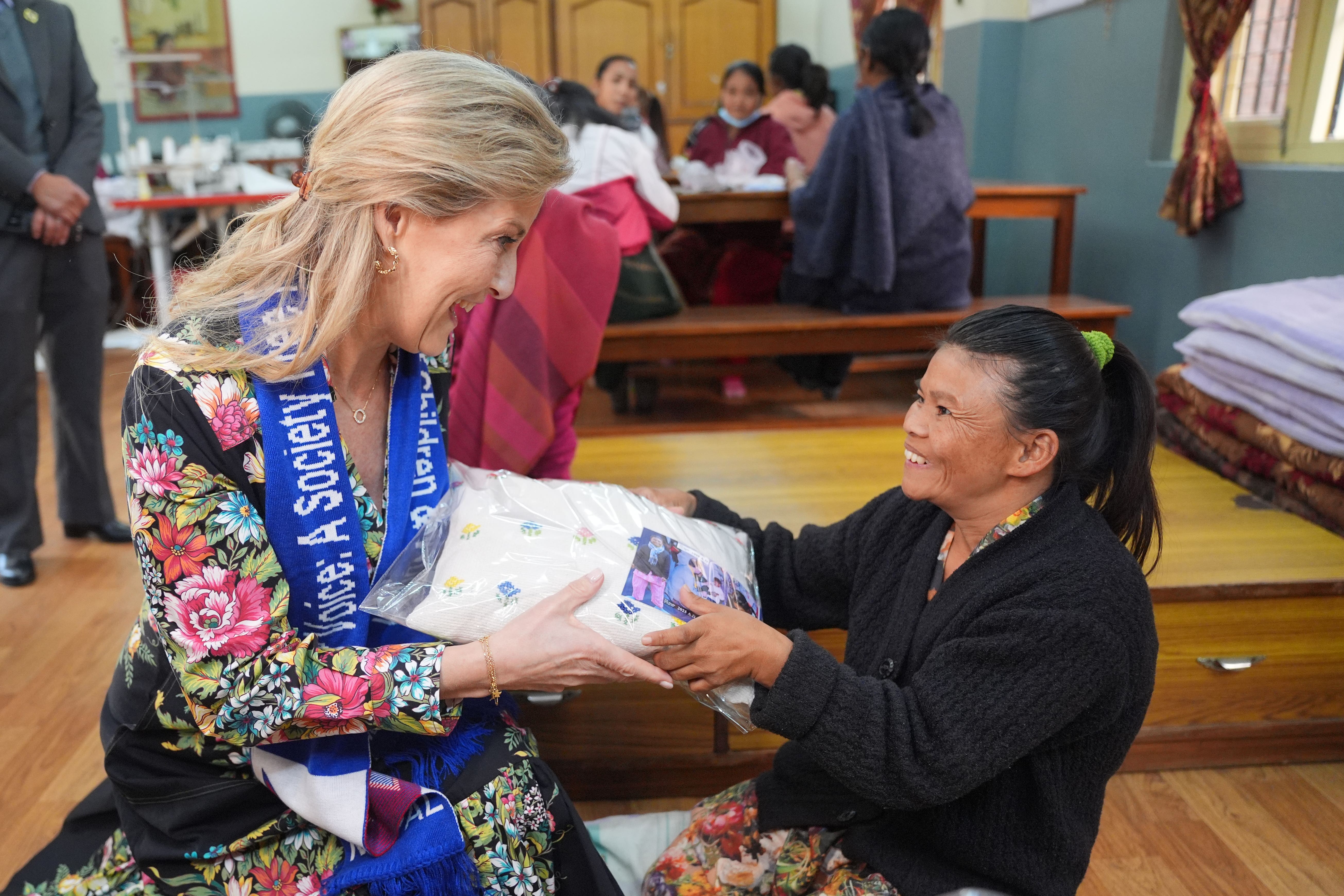 The Duchess of Edinburgh was presented with a gift during her visit to Maiti Nepal in Kathmandu (Yui Mok/PA)