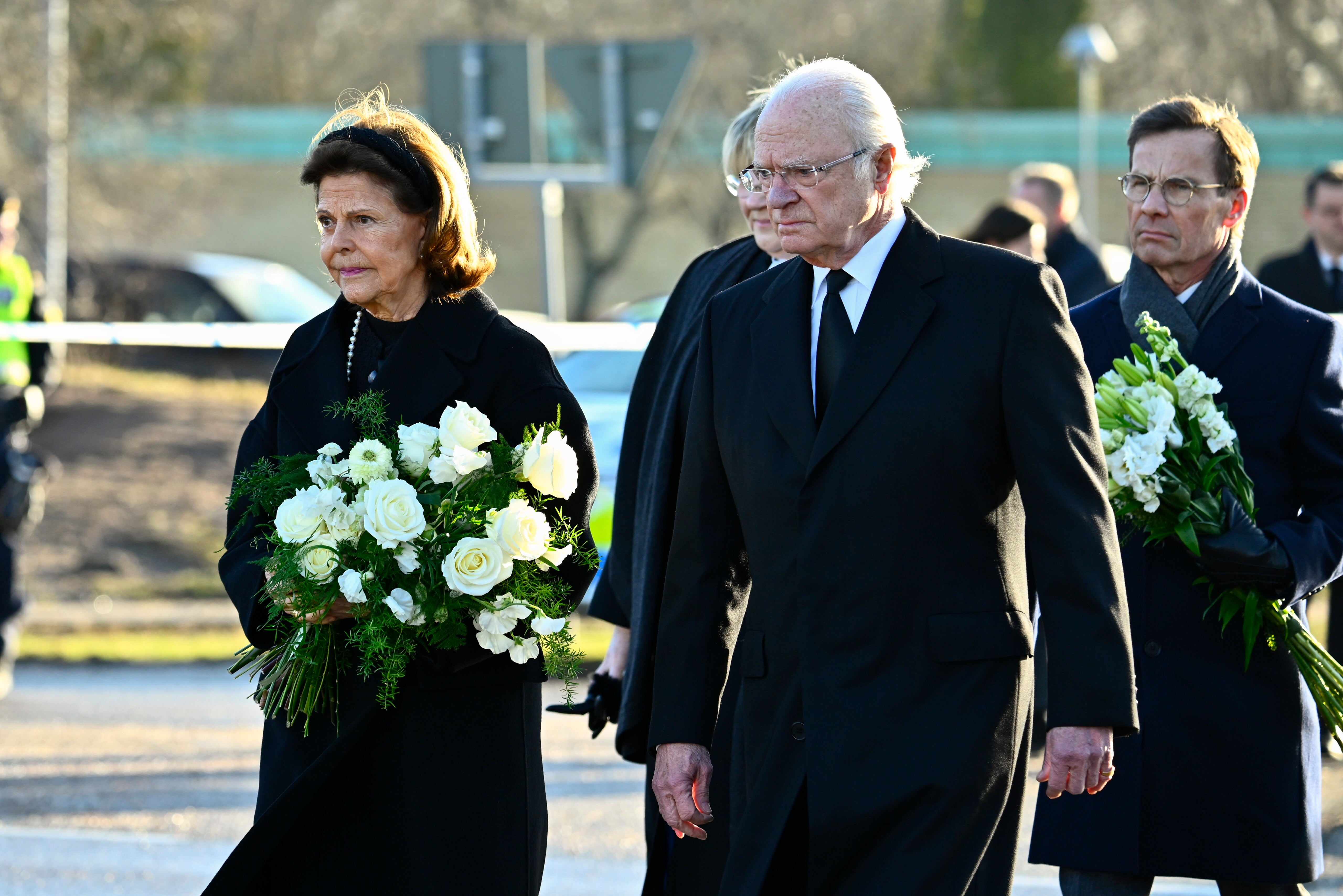 Prime minister Ulf Kristersson, right, followed behind the King and Queen of Sweden