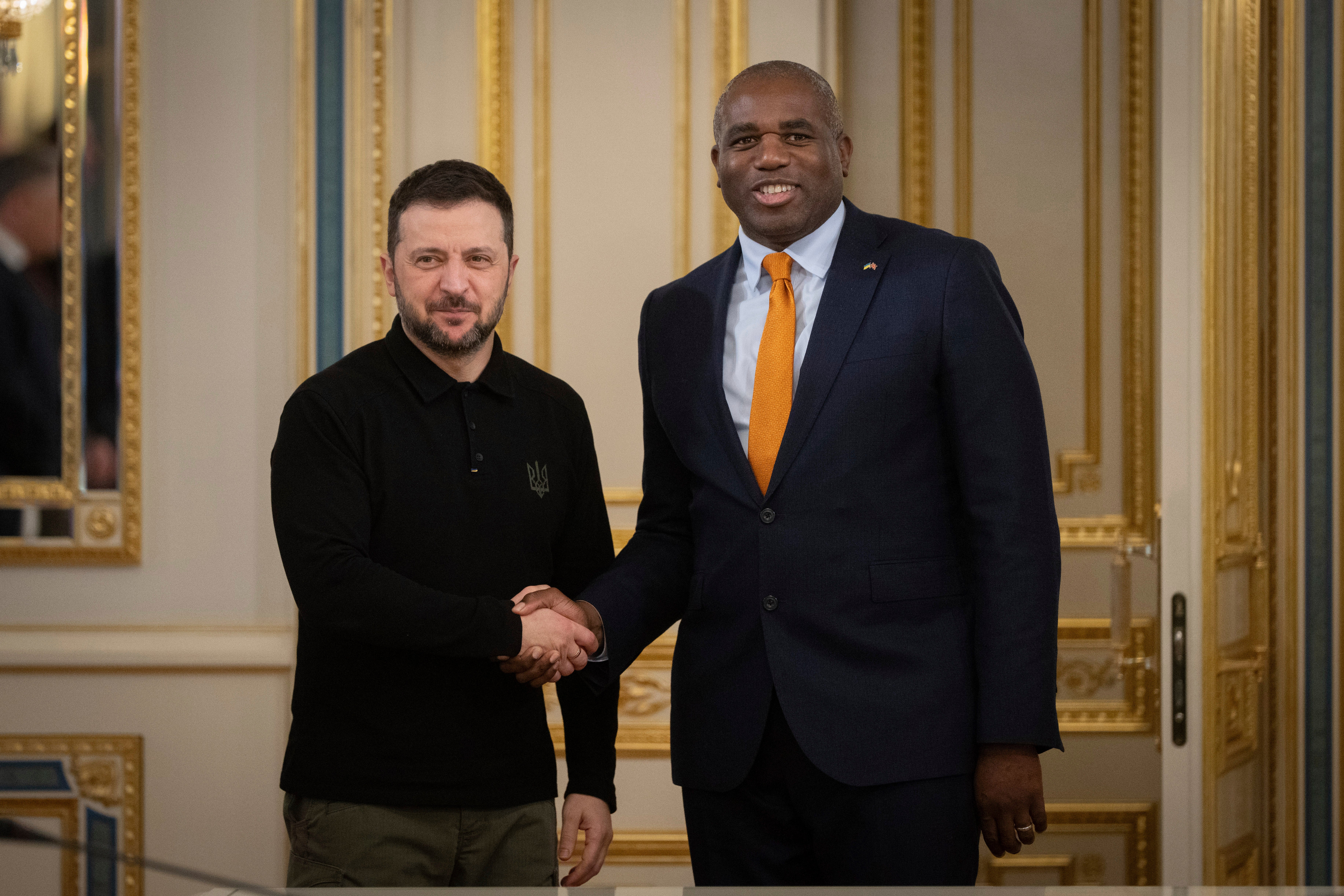 Ukraine's president Volodymyr Zelensky greets Britain's foreign secretary David Lammy during their meeting in Kyiv, Ukraine