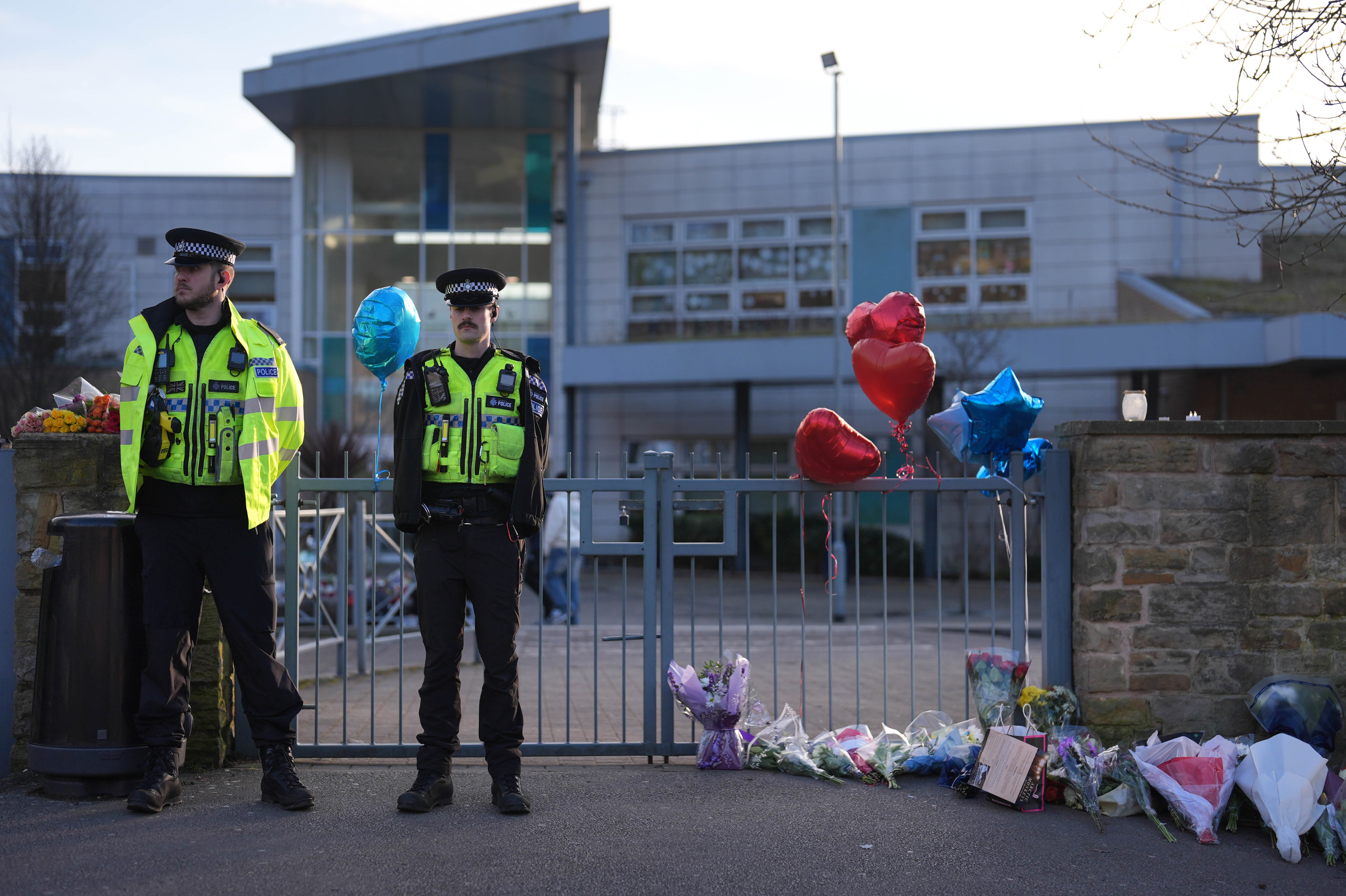 Balloons and flowers were left at the school gates