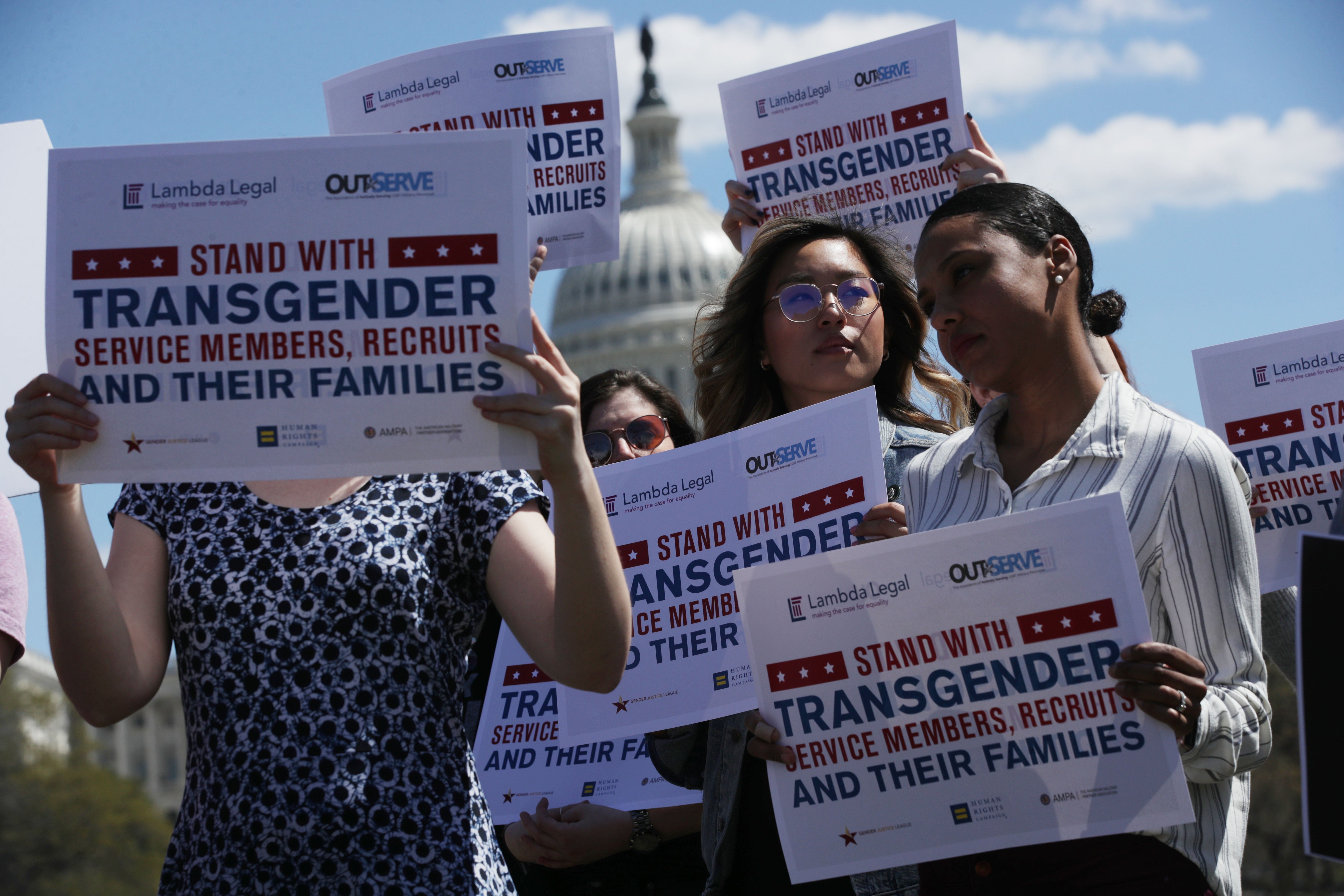 Demonstrators protest Trump's first ban on transgender people serving in the military in 2019. The policy was reversed by Biden.