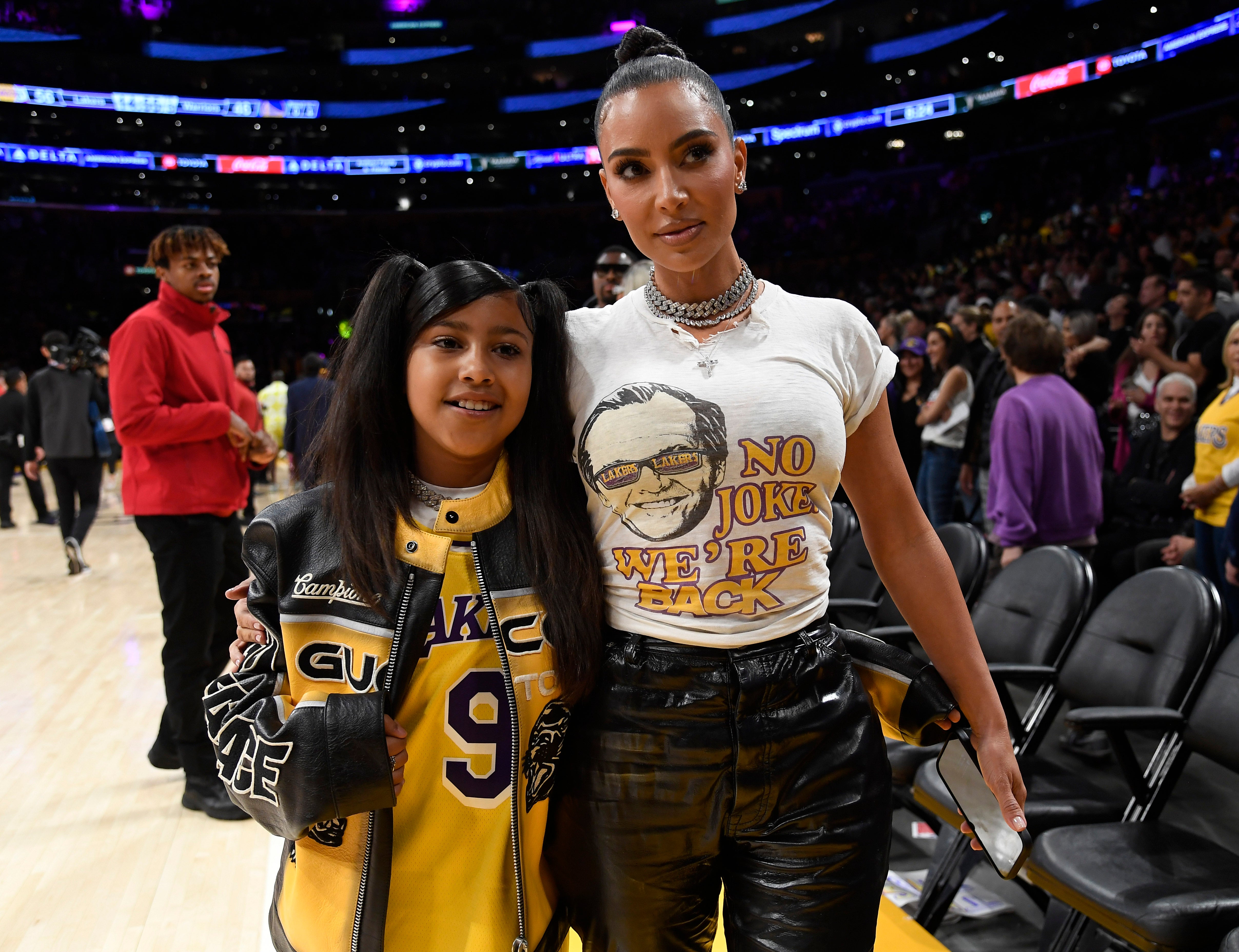 Kim Kardashian and North West at a Los Angeles Lakers game in 2023