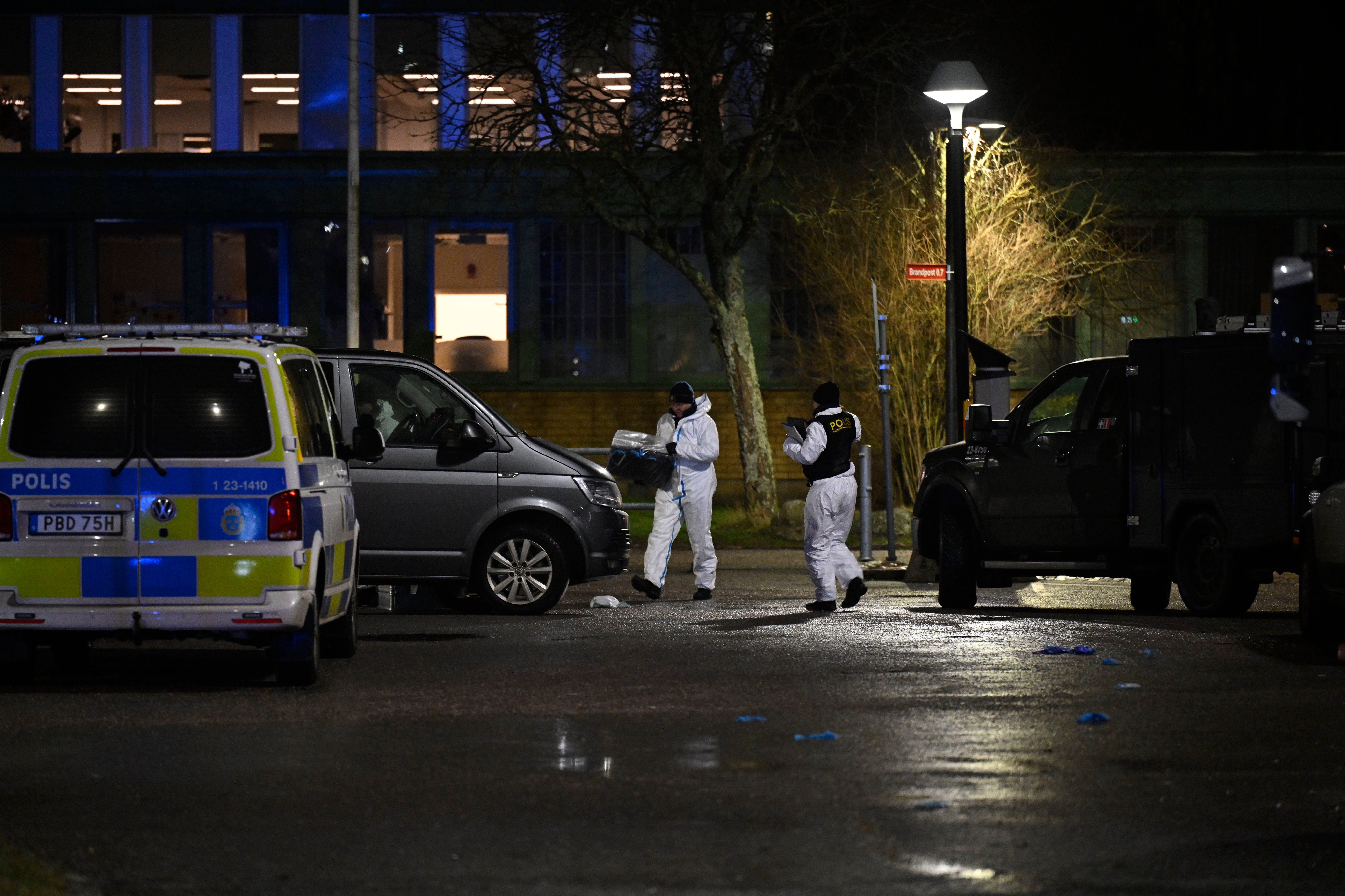 Police technicians work at the scene of a school shooting the Risbergska adult education center in Orebro, Sweden, 4 February 2025