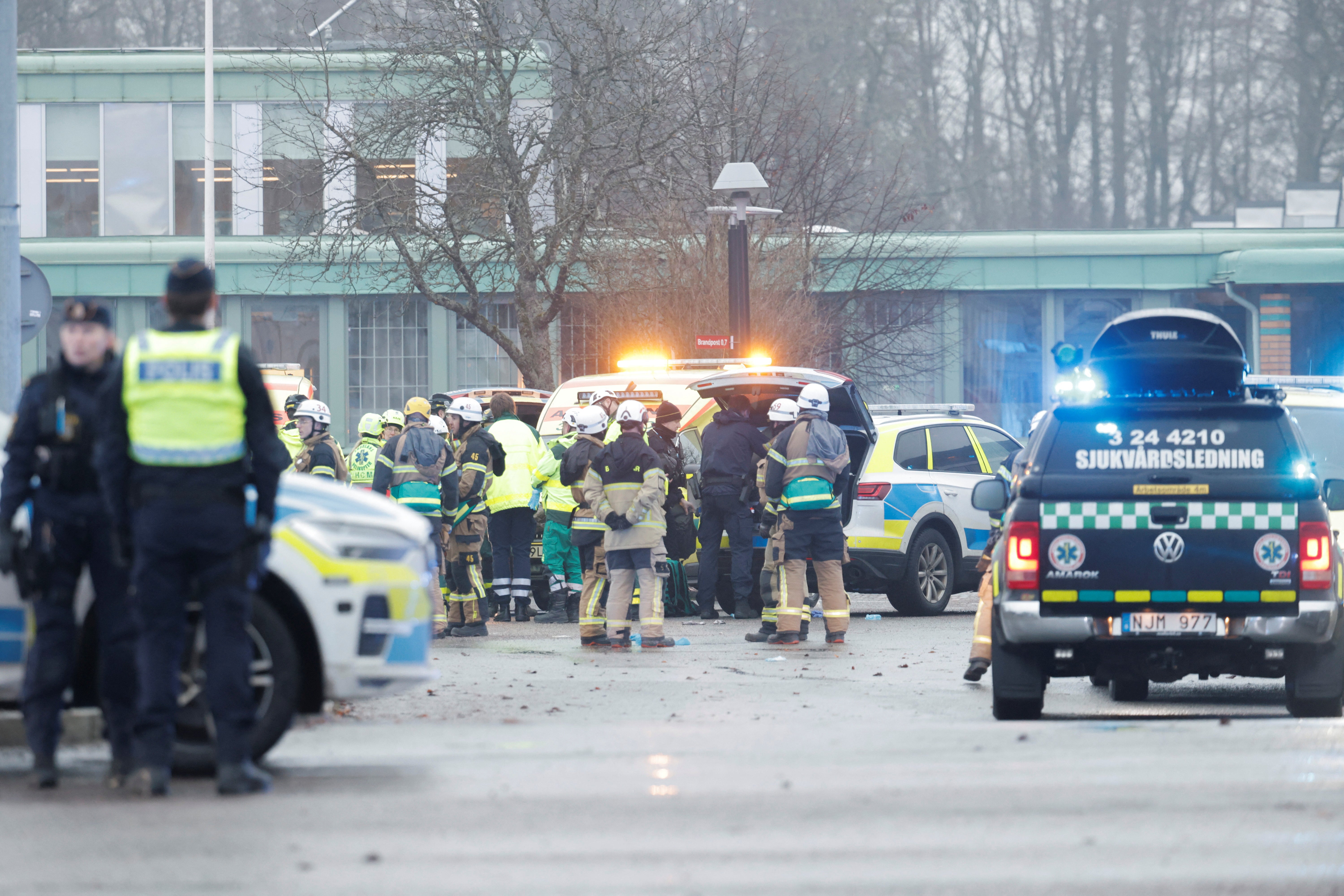 Emergency personnel and police officers work at the Risbergska School, a campus at the Adult Education Centre after being shot at Orebro, Sweden on Tuesday