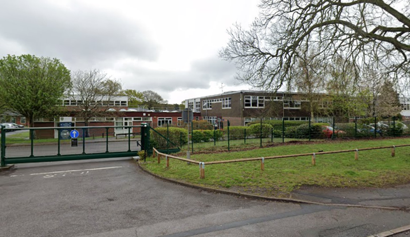 Teacher banned after offering pupils his number and touching them 'inappropriately’