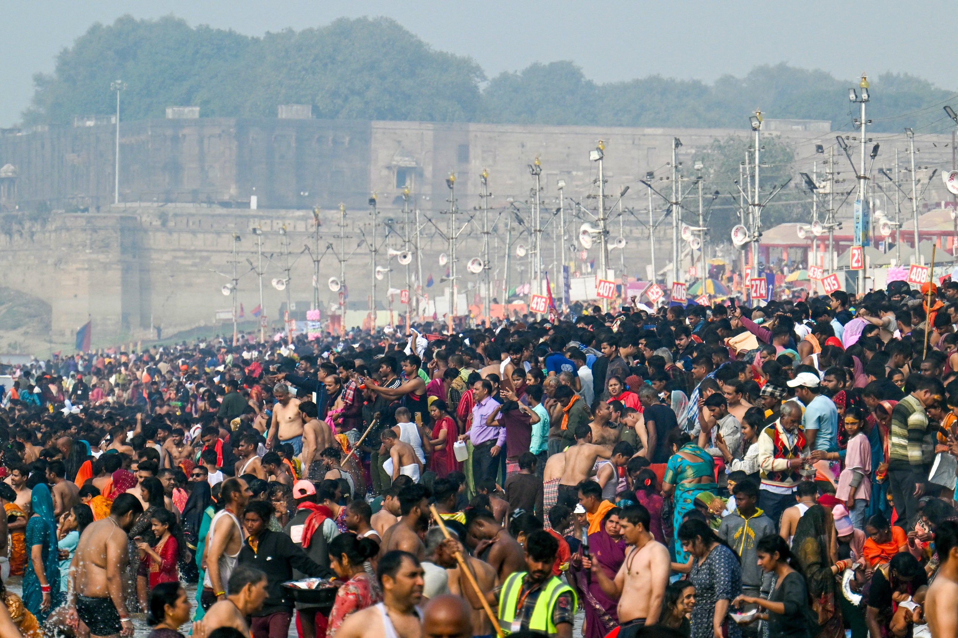 <p>Hindu pilgrims take a holy dip at Sangam, the confluence of rivers Ganga, Yamuna and mythical Saraswati, during the Maha Kumbh Mela in Prayagraj</p>