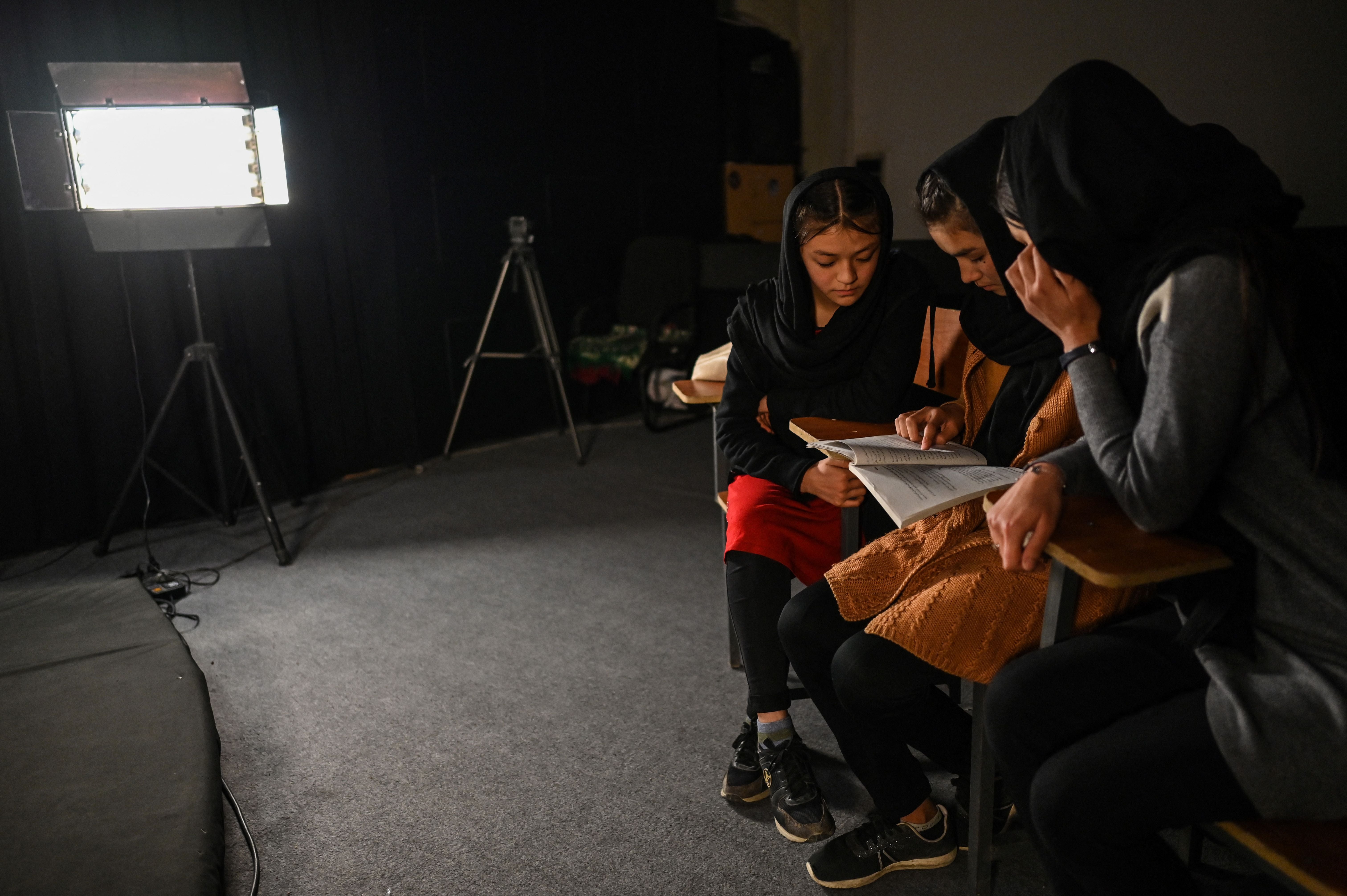 Students attending a class on-air at Radio Begum in Kabul in November 2021