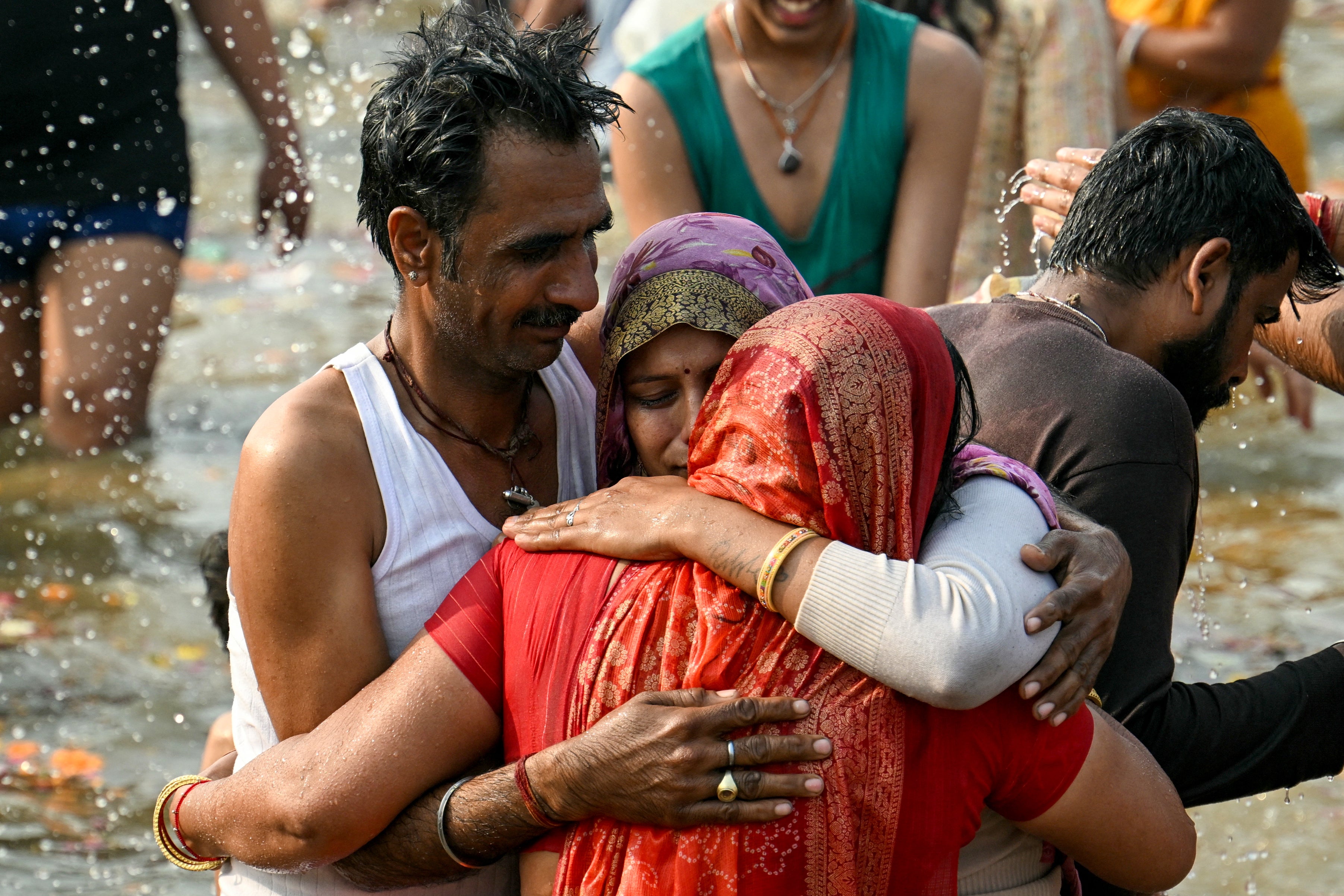 Hindu pilgrims take a holy dip during the Maha Kumbh Mela