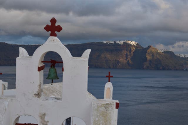 <p>The bell tower of an Orthodox church in the town of Oia on the earthquake-struck island of Santorini</p>