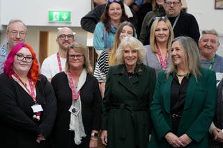 Legal battle over Harry's US visa documents reopens as William meets farmers - live Queen Camilla poses with staff members during a visit to CoLab Exeter (Alastair Grant/PA)
