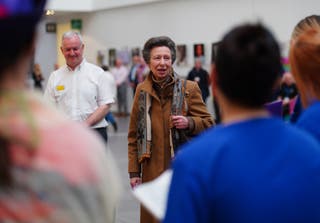 Anne chats to hospital staff (Ben Birchall/PA)