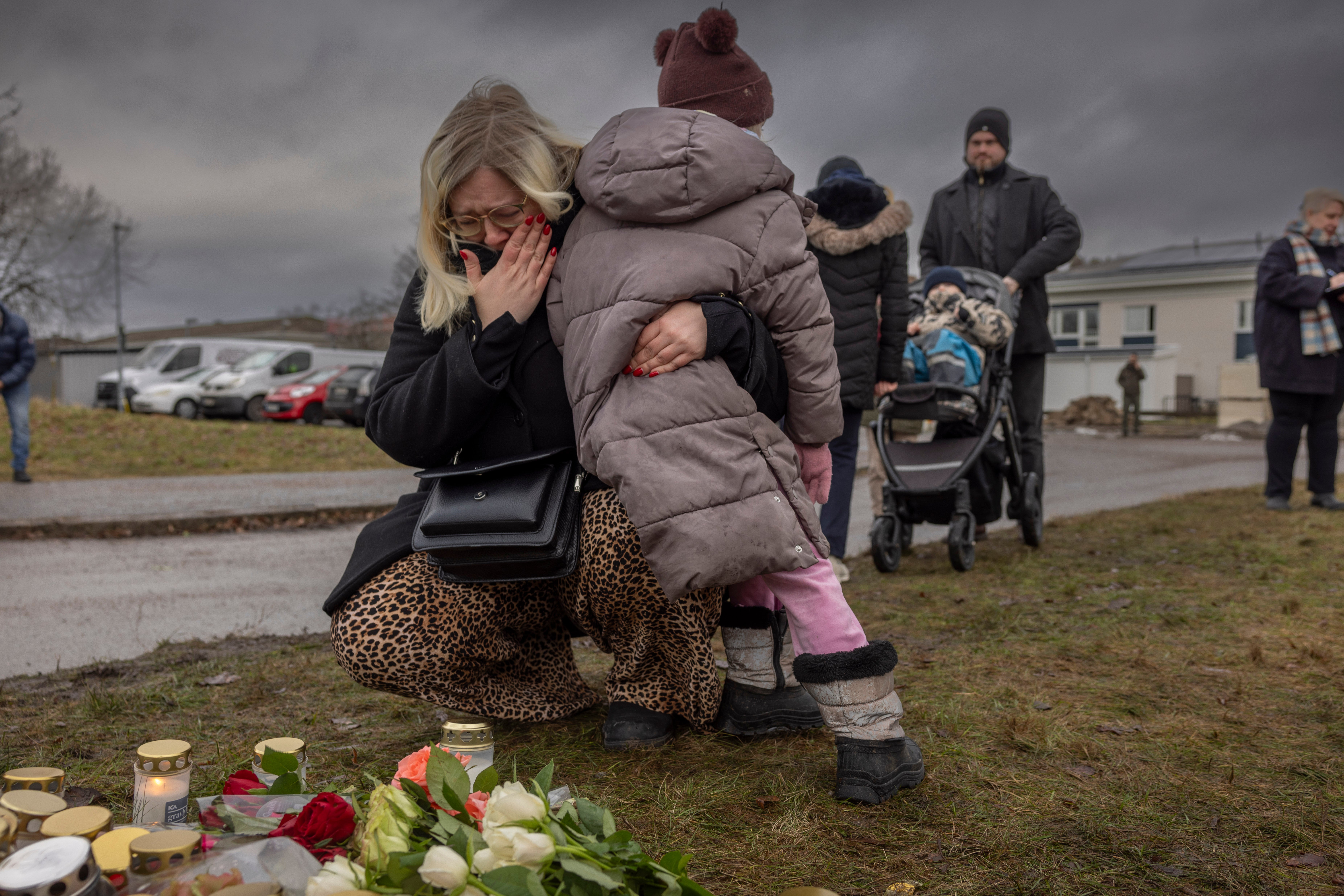 Mourners gather at the site to pay tribute to the victims on 5 February 2025 in Orebro, Sweden