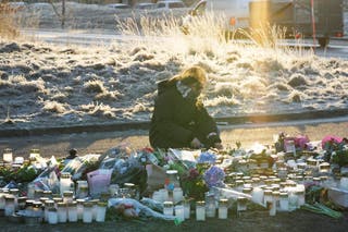 On the third day of the filming, mourners lit candles and lay flowers.