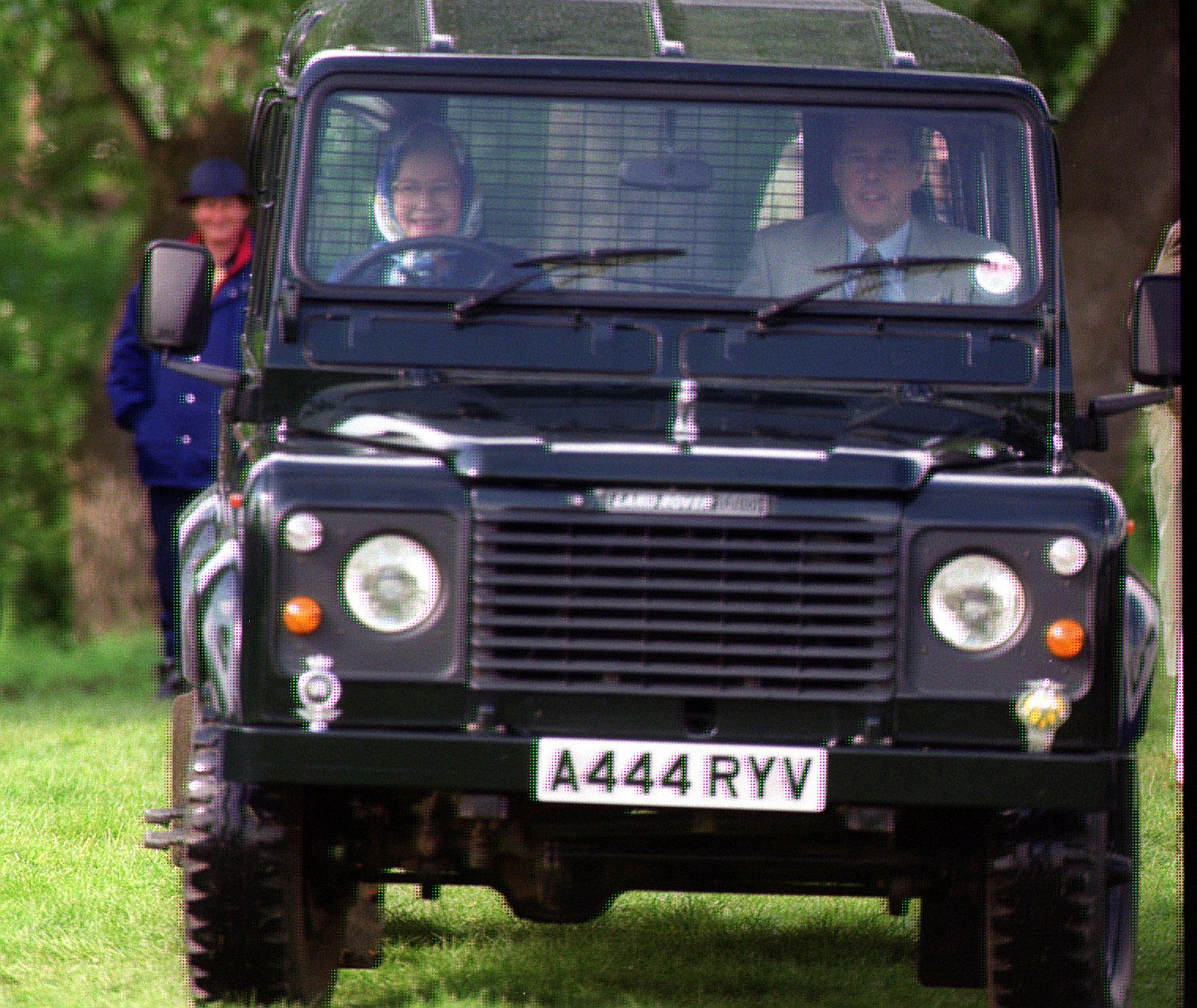 Queen Elizabeth II driving her personally commissioned Land Rover Defender 110 V8 at the Royal Windsor Horse Show.