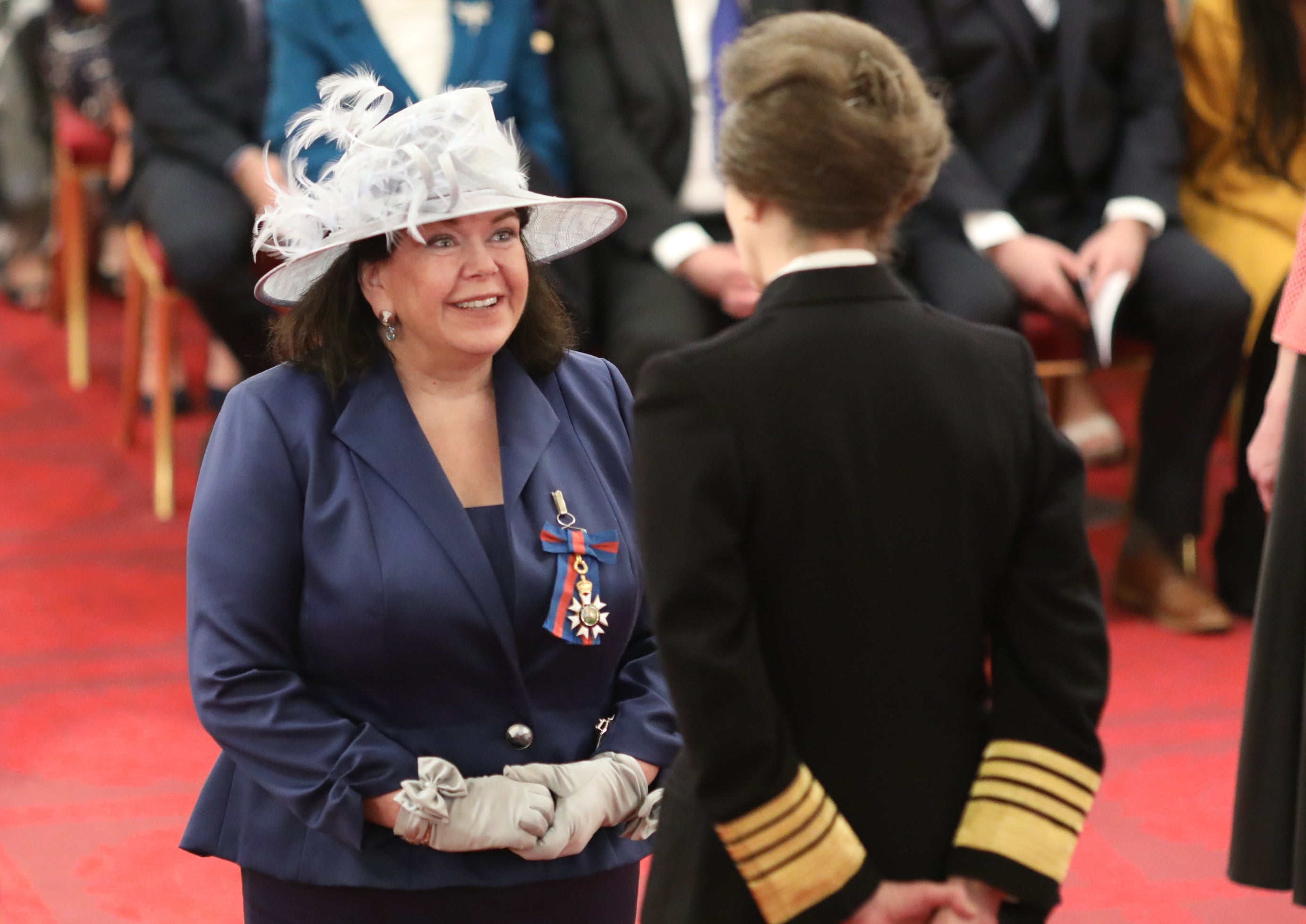 Pierce meeting Princess Anne at Buckingham Palace in 2019