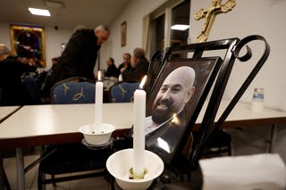 Photos of Salim Iskev, the victim of the mass shooting, are on display at St. Mary's Church in Orebro, Sweden