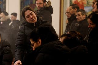 Family members of mass shooting victim Salim Iskef mourn at St. Mary's Church in Orebro, Sweden