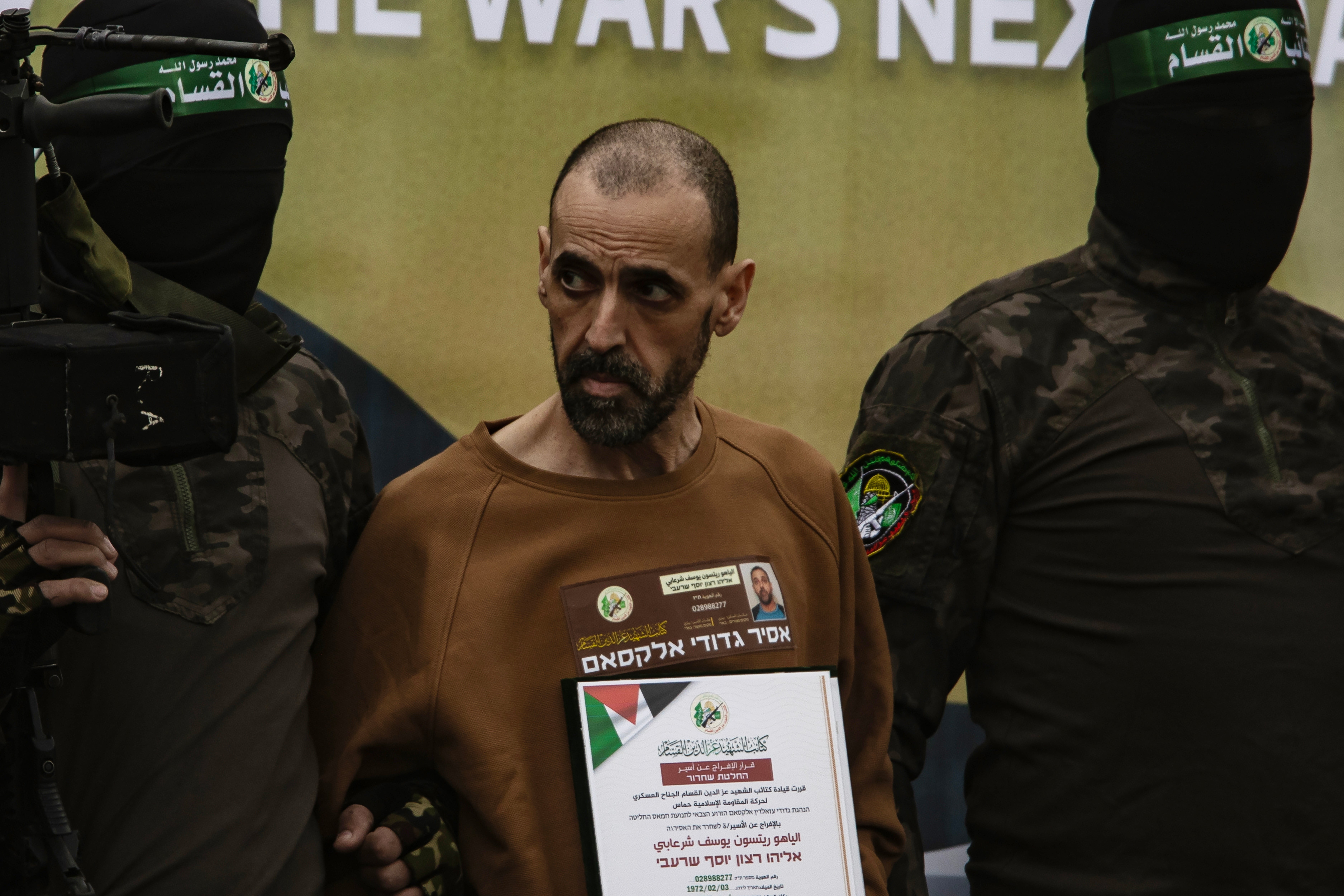 Israeli hostage Eli Sharabi is taken on by militants before he was handed over to a Red Cross team in Deir al-Balah, central Gaza, 08 February 2025