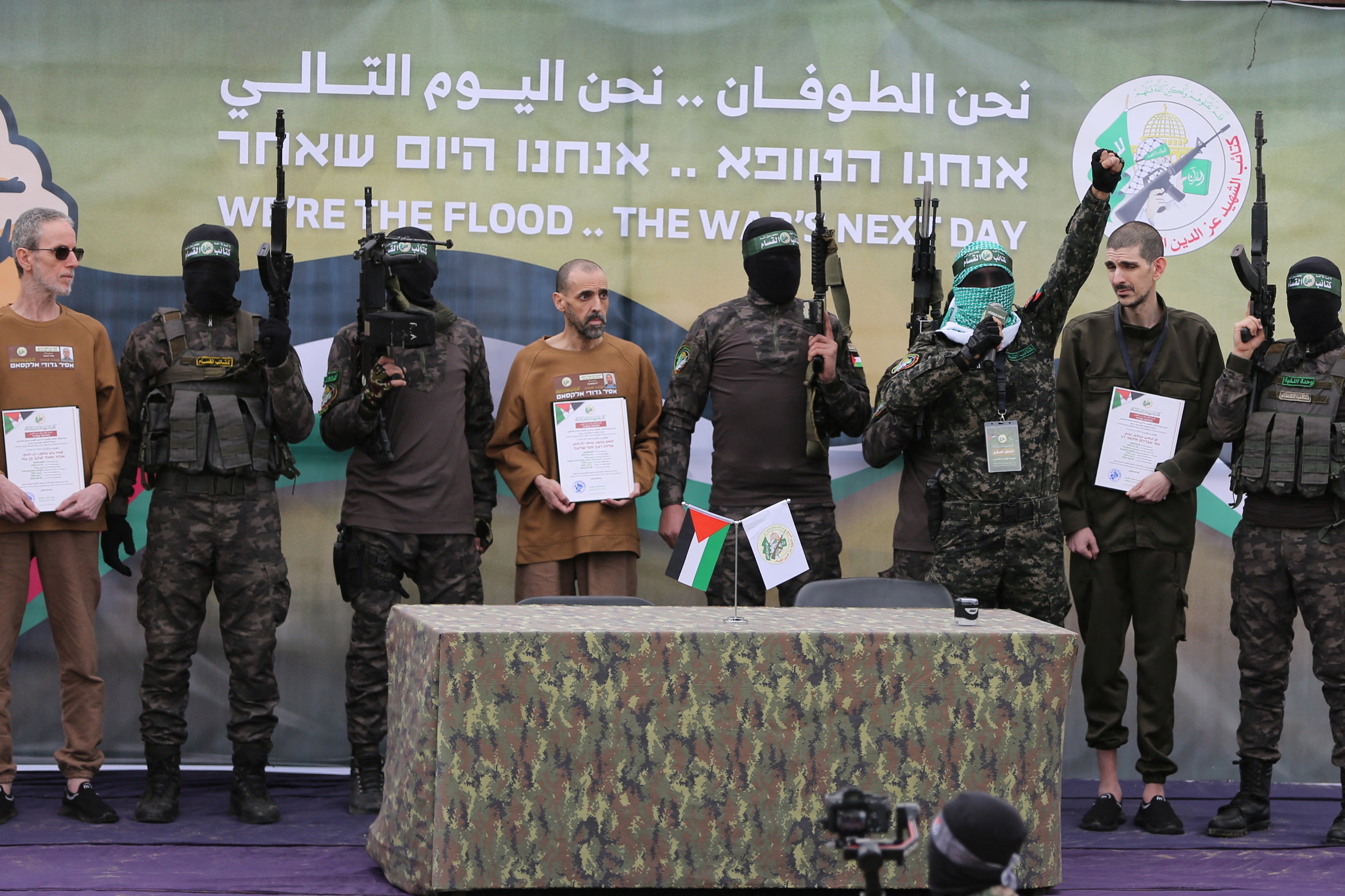 Or Levy, Eli Sharabi and Ohad Ben Ami, hostages held in Gaza since the deadly October 7, 2023 attack, are released by Hamas militants as part of a ceasefire and a hostages-prisoners swap deal between Hamas and Israel in Deir Al-Balah in the central Gaza Strip, February 8, 2025.