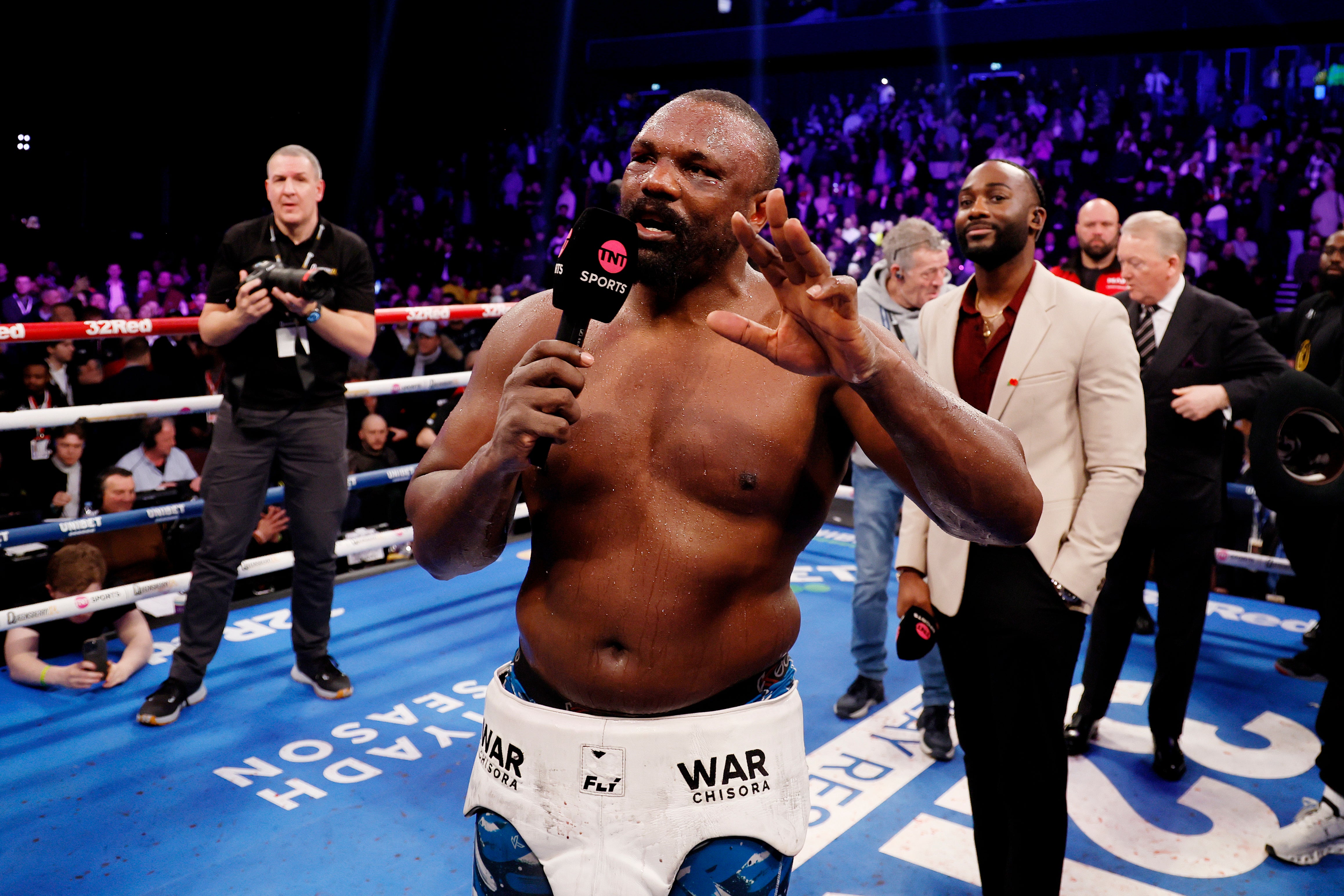 Derek Chisora speaks to the crowd after winning the IBF world heavyweight title eliminator bout against Otto Wallin