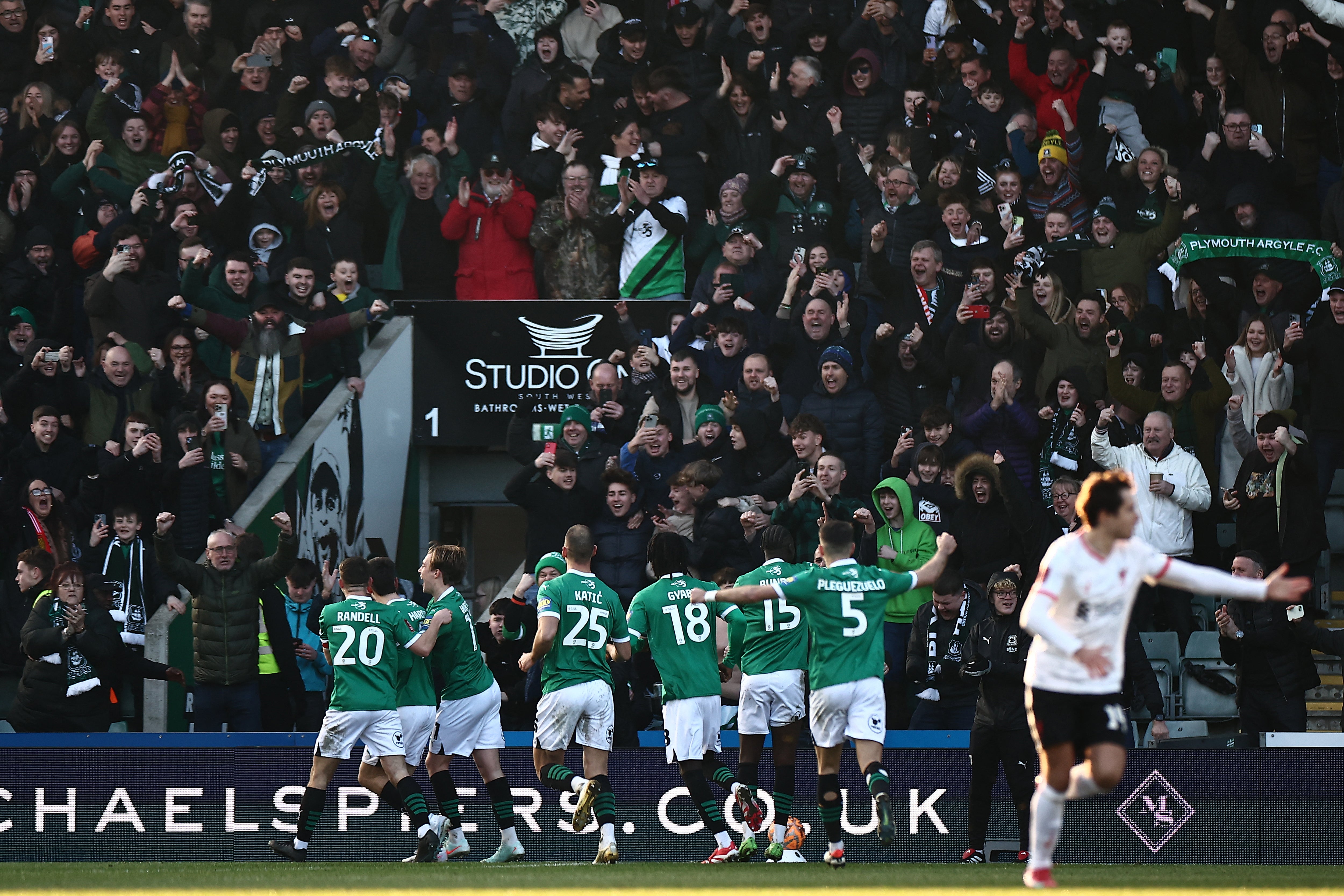 Ryan Hardie is mobbed by teammates after scoring the opening goal