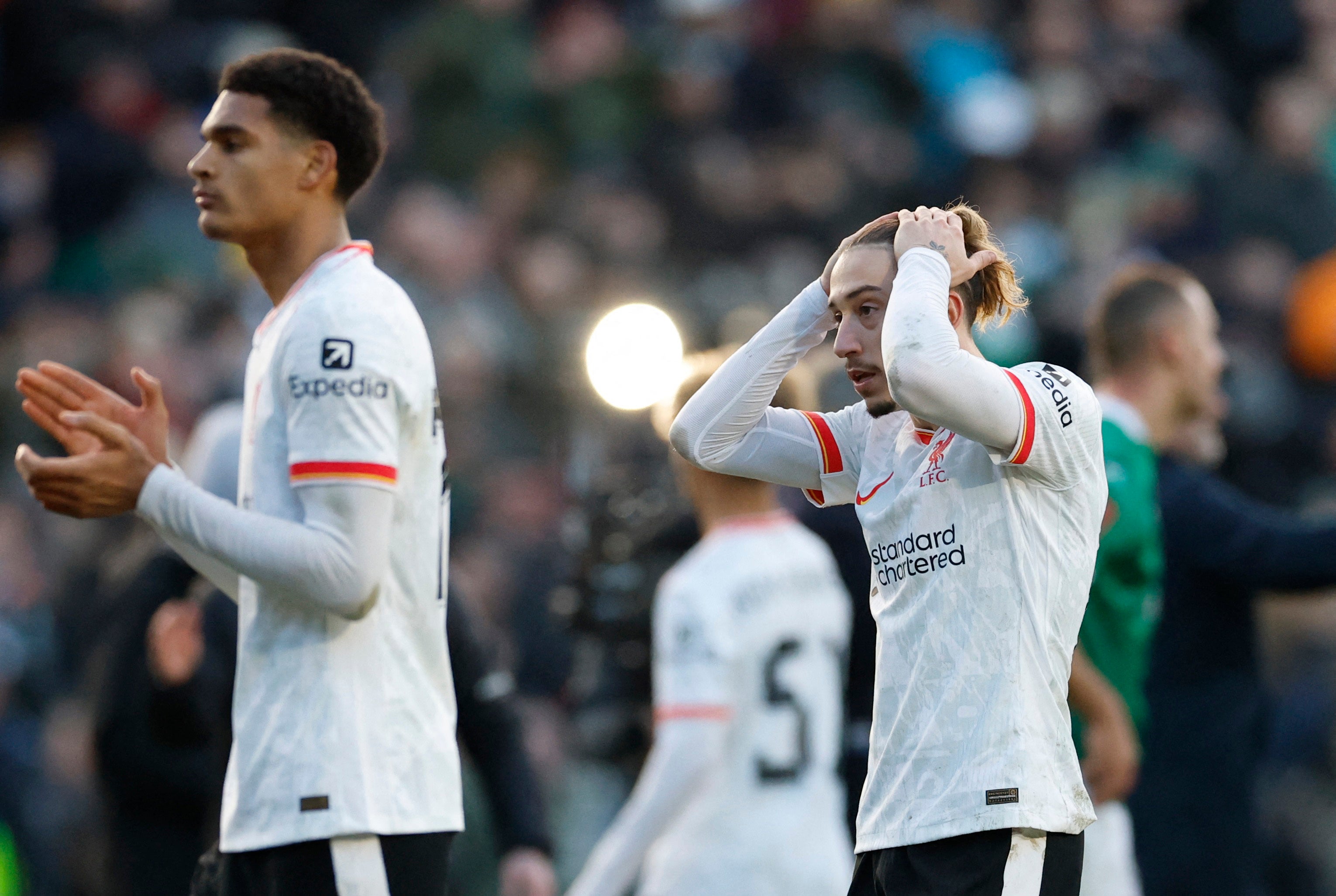 Liverpool’s Kostas Tsimikas looks dejected after the match