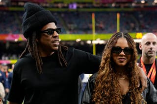 Jay-Z and his daughter Blue Ivy Carter, right, are seen on the sidelines before the NFL Super Bowl 59 football game between the Kansas City Chiefs and the Philadelphia Eagles, Sunday, Feb. 9, 2025, in New Orleans