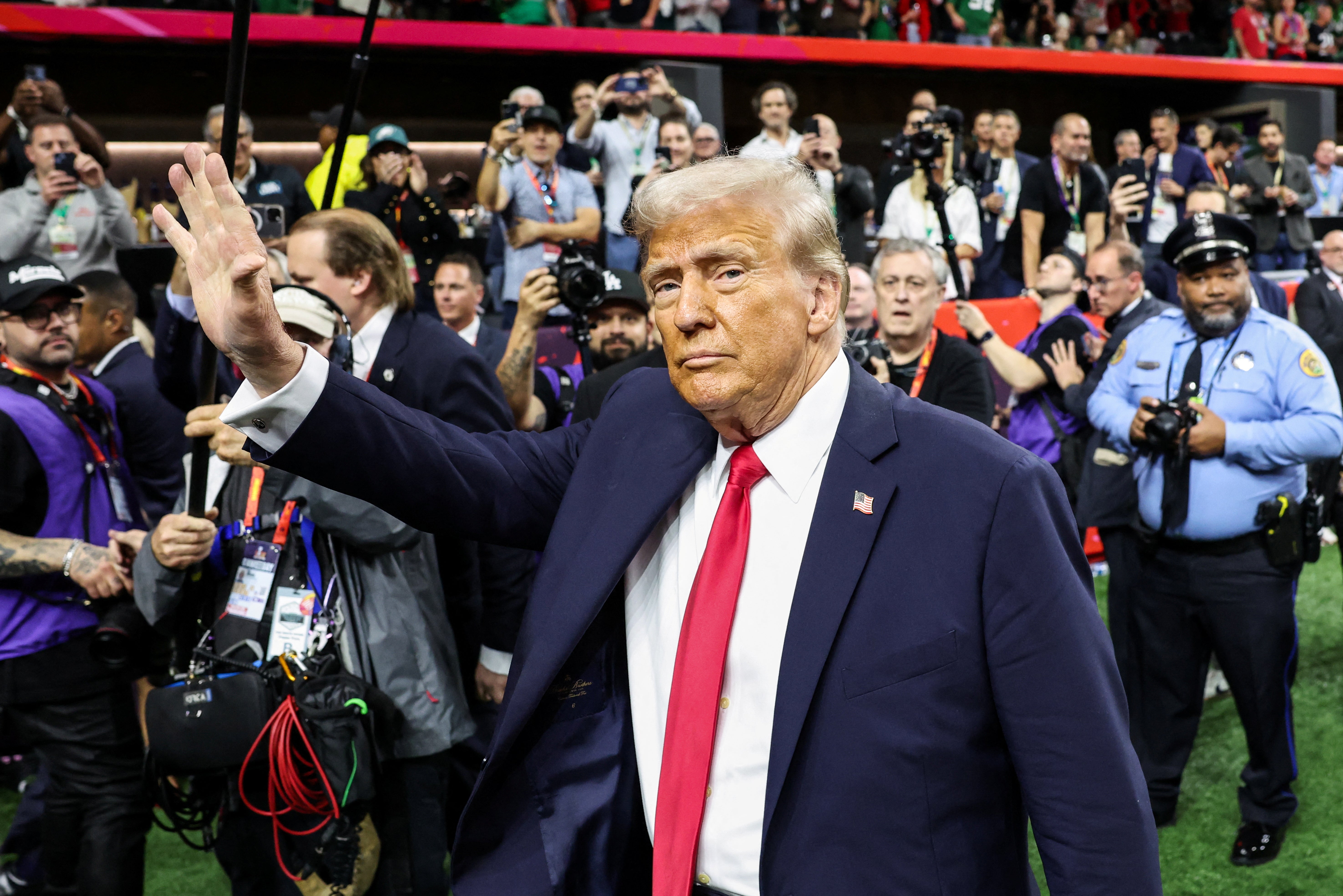 U.S. President Donald Trump greets people as he attends the Super Bowl LIX in New Orleans, Louisiana, U.S., February 9, 2025