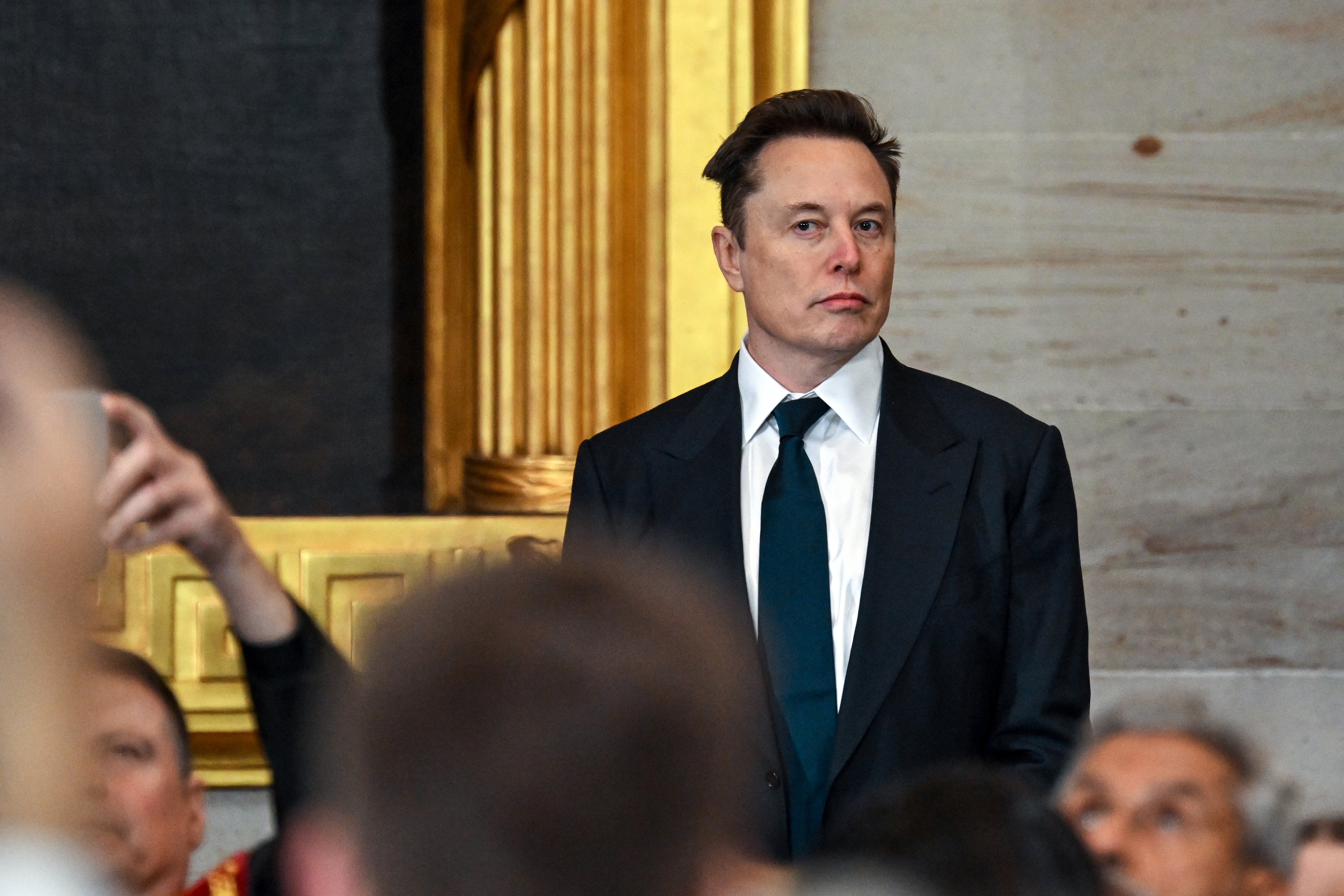 Elon Musk arrives for the inauguration of Donald Trump in the U.S. Capitol Rotunda on January 20, 2025, in Washington, D.C. Musk and JD Vance have been questioning the authority of judges