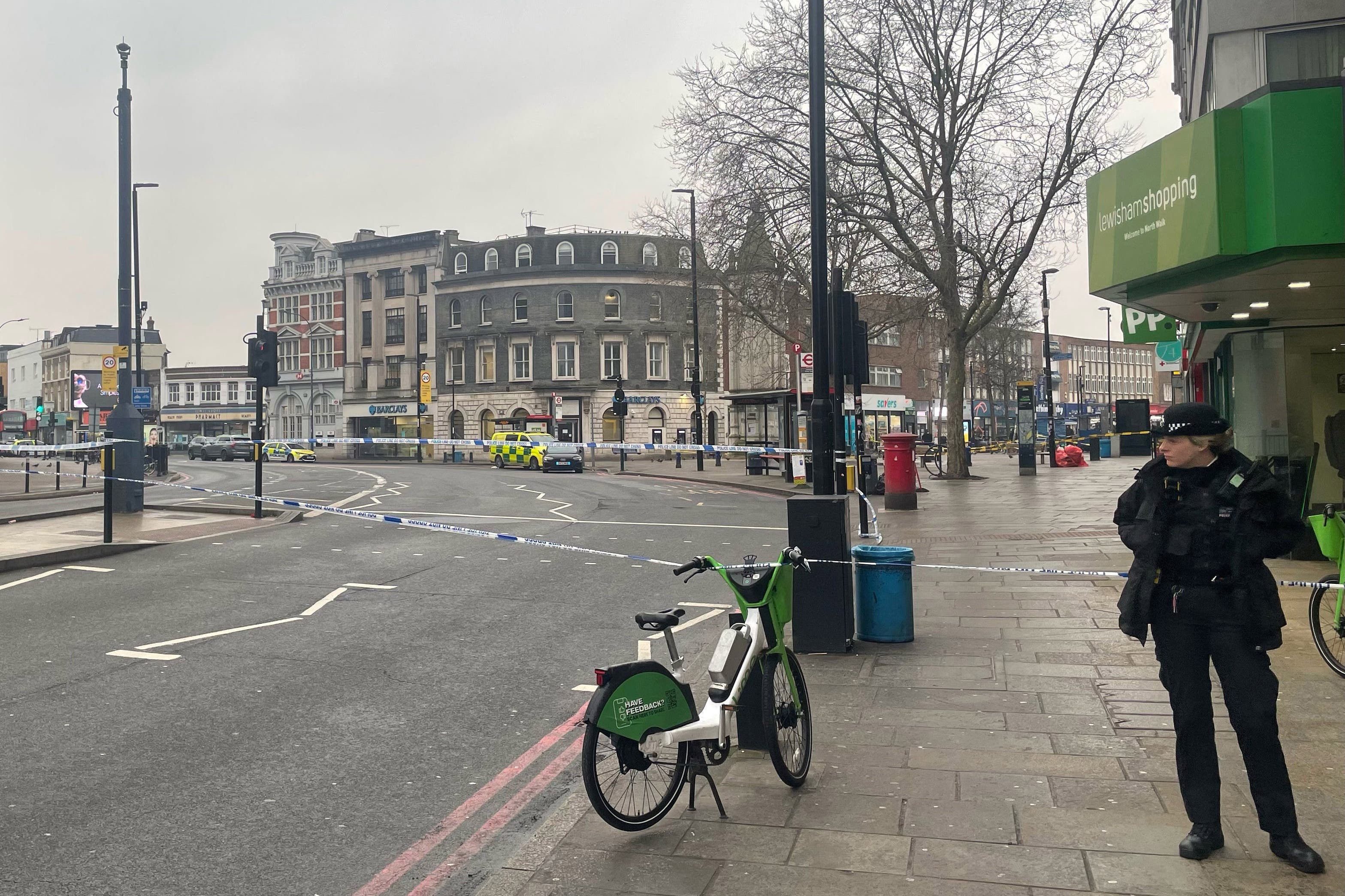 Police during a standoff at a building in Lewisham High Street in south-east London after a man in a dressing gown was seen brandishing a knife out of the window. (George Lithgow/PA)