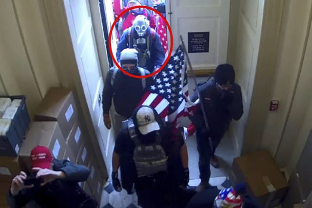 <p>Dan Edwin Wilson, a Jan 6 insurrectionist circled in red, was issued a presidential pardon for his </p>