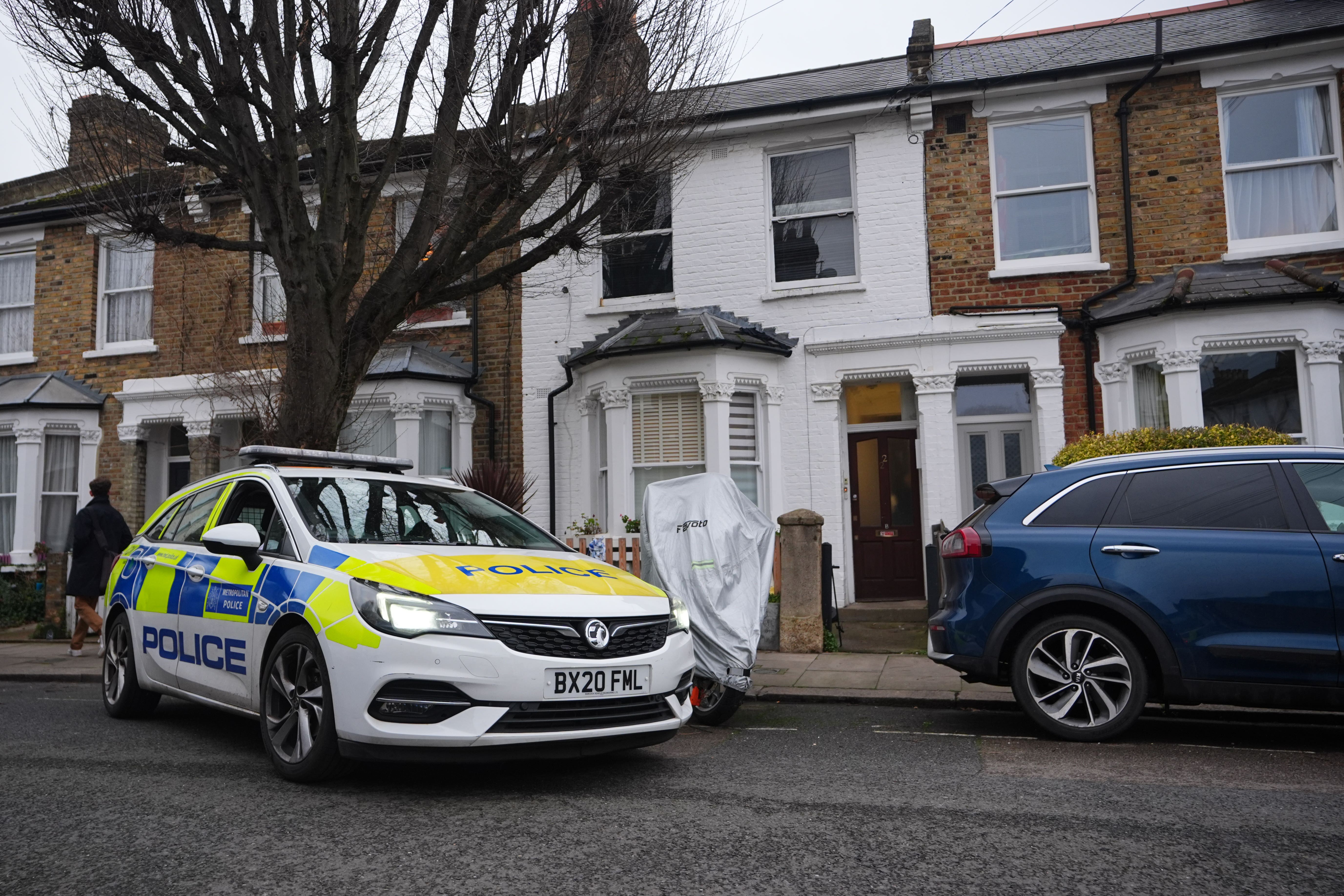 The scene in Coulter Road, Hammersmith, west London, following the death of a woman after a man was seen trying to force his way into a flat (James Manning/PA)